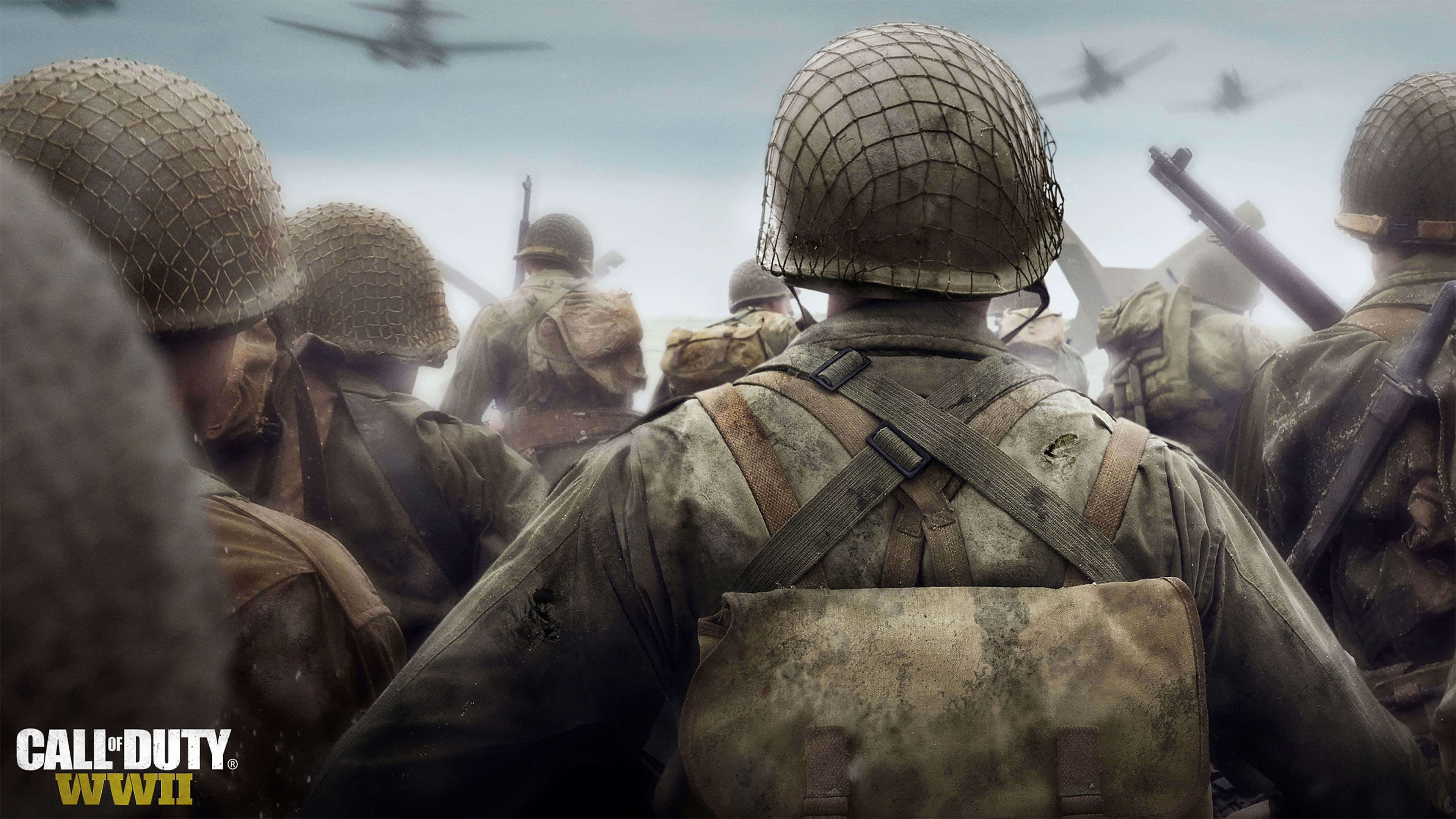 Cod 桌布 壁紙 — 士兵們戴著二戰頭盔、穿著泥濘的軍服向前行進，戰鬥機在頭頂飛過，呈現出 gritty 的戰場場景。