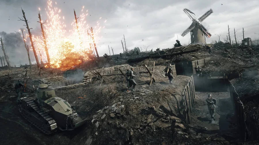 Battlefield 1 HD 桌布 壁紙 — 士兵和一輛坦克在戰火摧殘的戰場上前進，同時一個爆炸在破損的風車附近爆發。