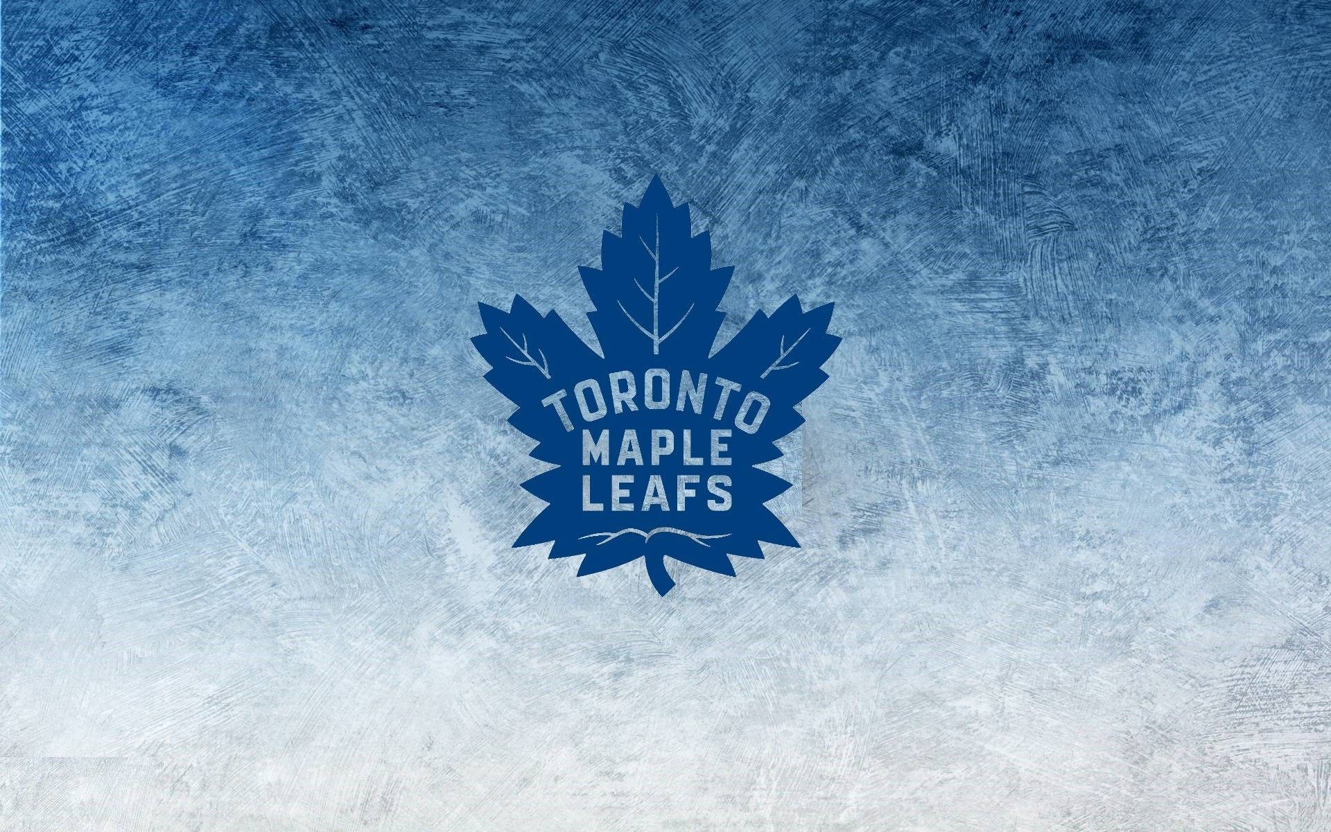 Leafs 桌布 壁紙 — 多倫多楓葉隊標誌居中於帶紋理的冰藍色和白色背景上。