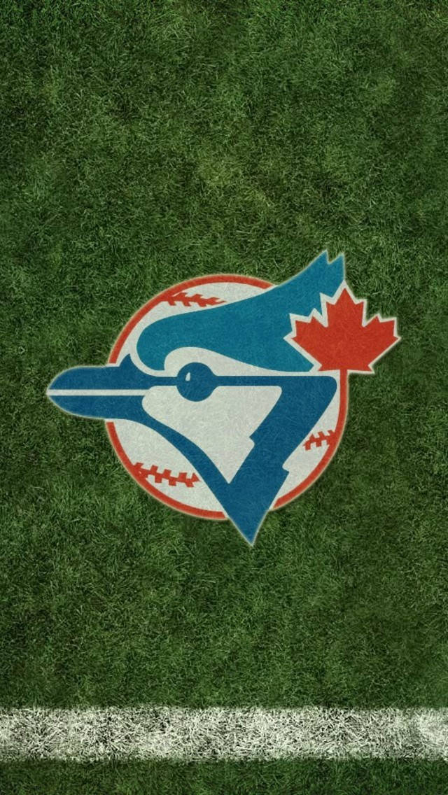 Jays 桌布 壁紙 — 多倫多藍鳥隊棒球標誌居中於充滿活力的綠色草地上，帶有清晰的白色底線。