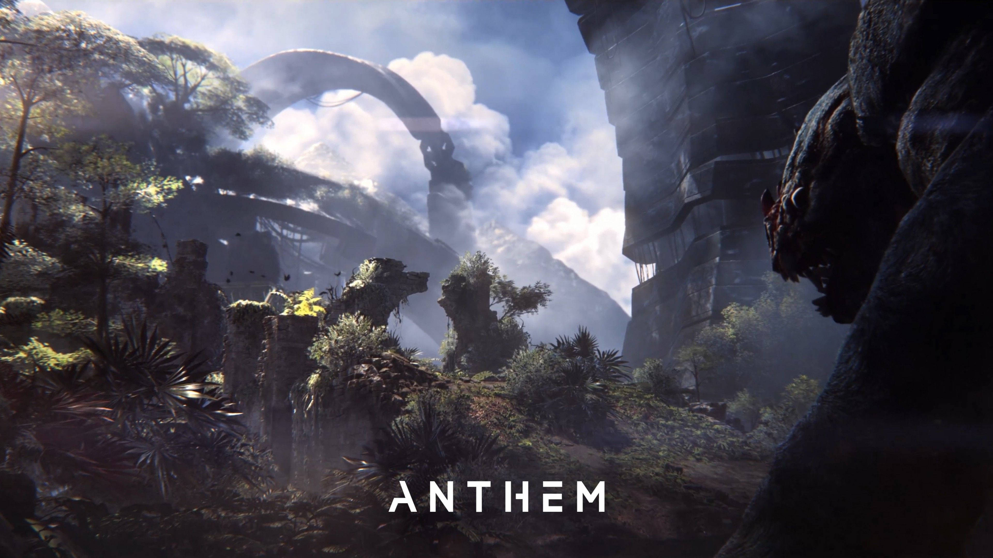 anthem 4K 桌布 壁紙 — 多雲天空下，霧氣瀰漫的叢林景觀，有古老石頭廢墟和巨大的拱門。