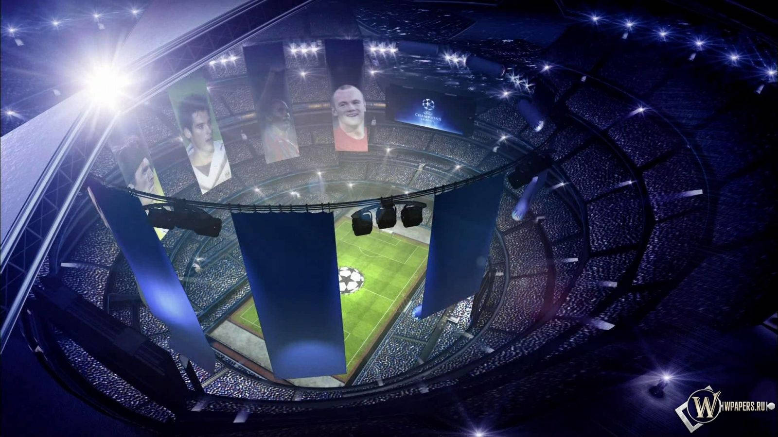 Champions League 桌布 壁紙 — 夜晚一個擠滿人的足球場的鳥瞰圖，明亮的燈光照亮球場，巨大的球員橫幅懸掛在上方。
