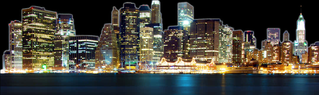 城市 桌布 壁紙 — 夜晚充滿活力的城市天際線全景，發光的摩天大樓倒映在平靜的水面上。