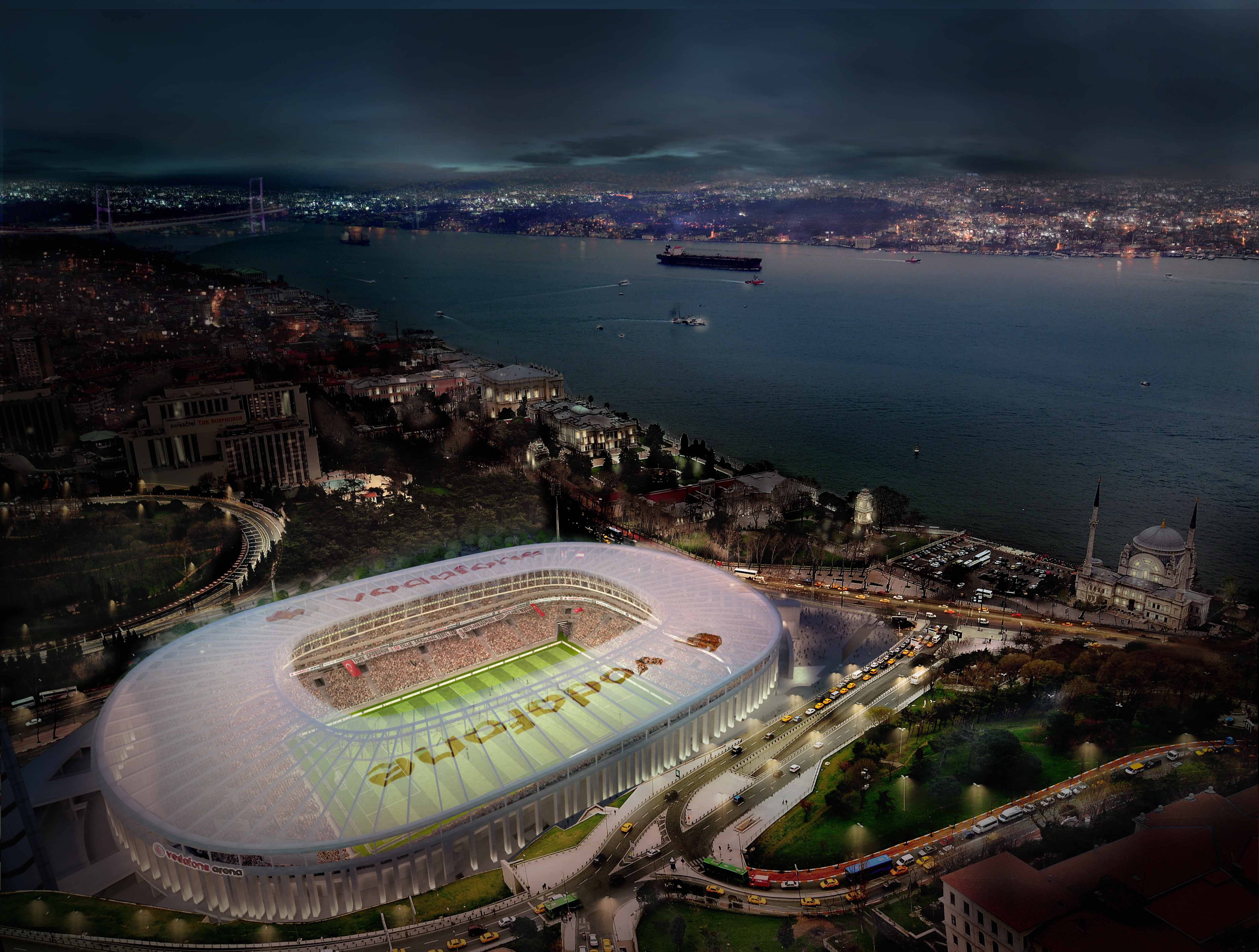 Stadium 桌布 壁紙 — 夜晚發光的Vodafone Arena體育場，依偎在城市景觀和一條黑暗的水道旁，遠處有橋樑和船隻。