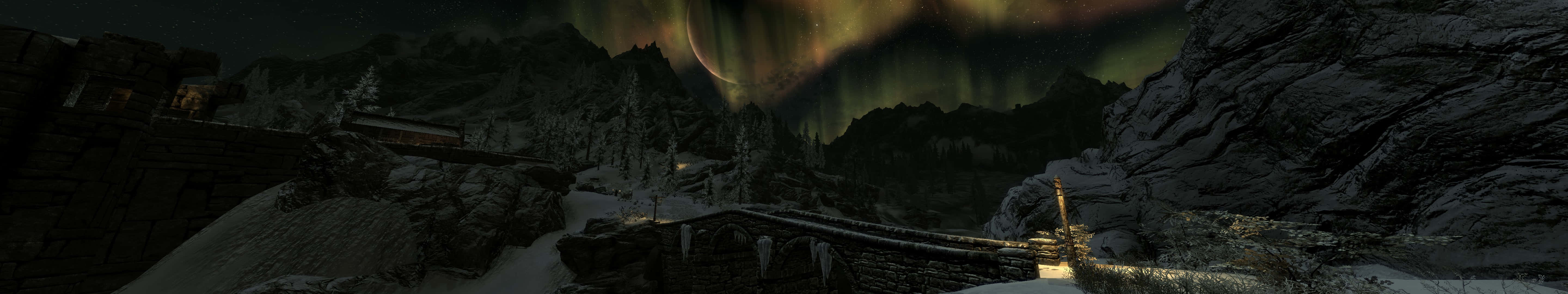 aurora borealis 桌布 壁紙 — 夜晚被鮮綠色北極光照亮的雪白山隘，北極光在古代石頭廢墟上方舞動。