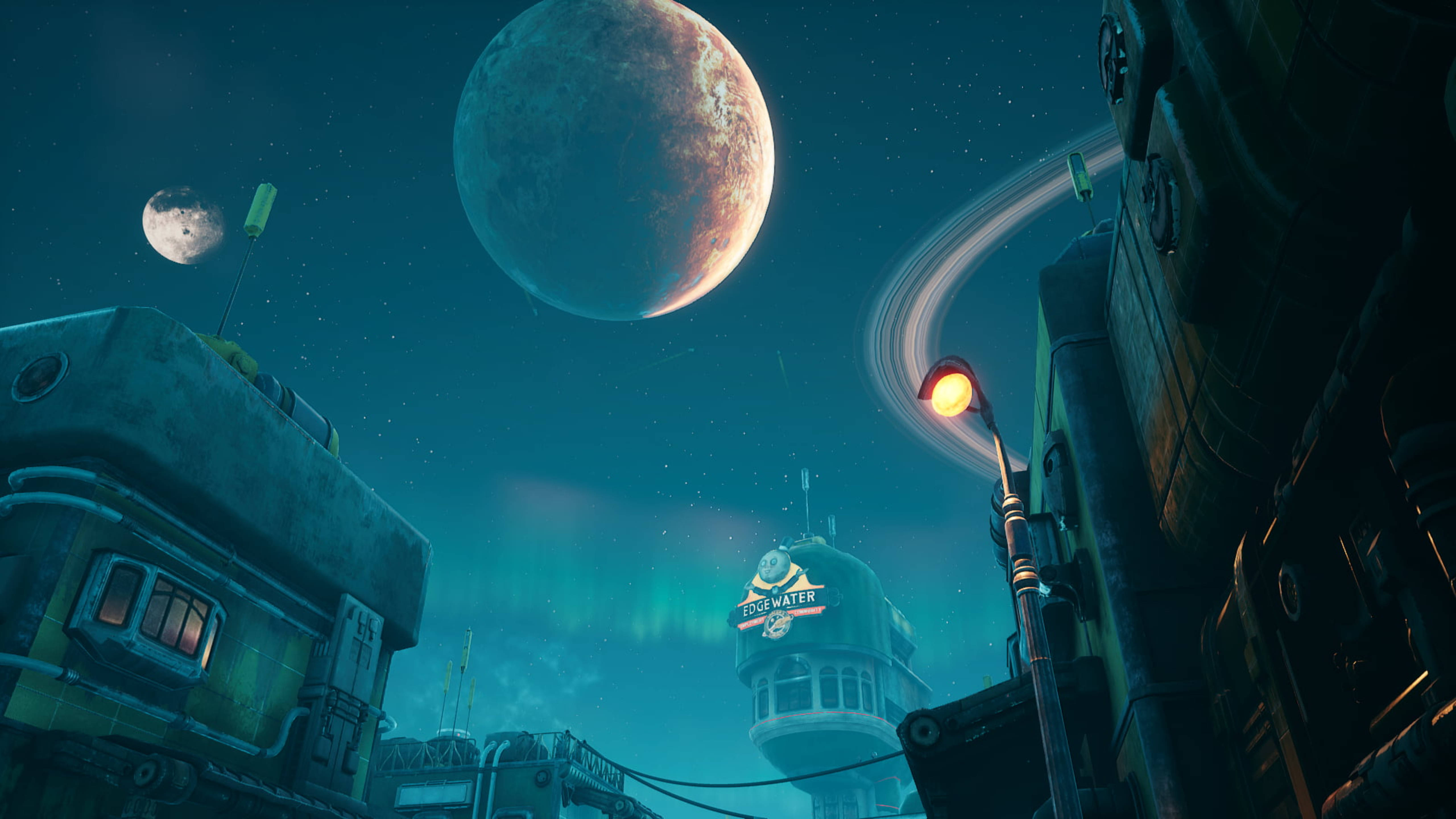 Outer Worlds 桌布 壁紙 — 夜晚霓虹燈照亮的外星城市街道，生鏽建築物上方的星空中有巨大的行星和光環閃耀。