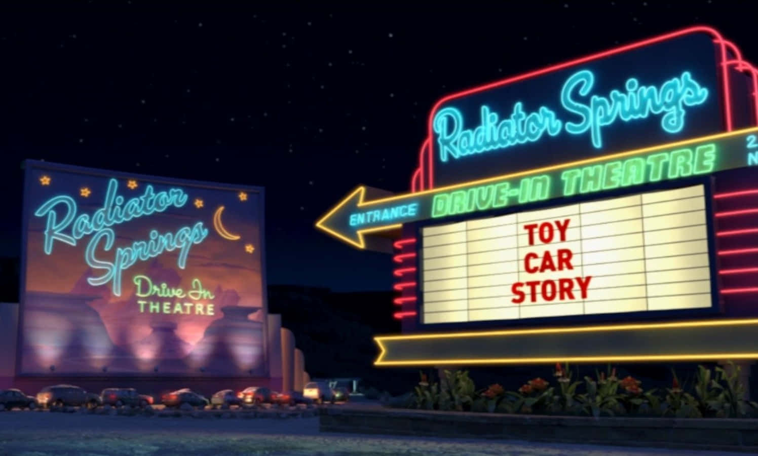 theatre 桌布 壁紙 — 夜晚霓虹燈閃爍的活力汽車影院，帶有Radiator Springs和Toy Car Story的發光標誌。