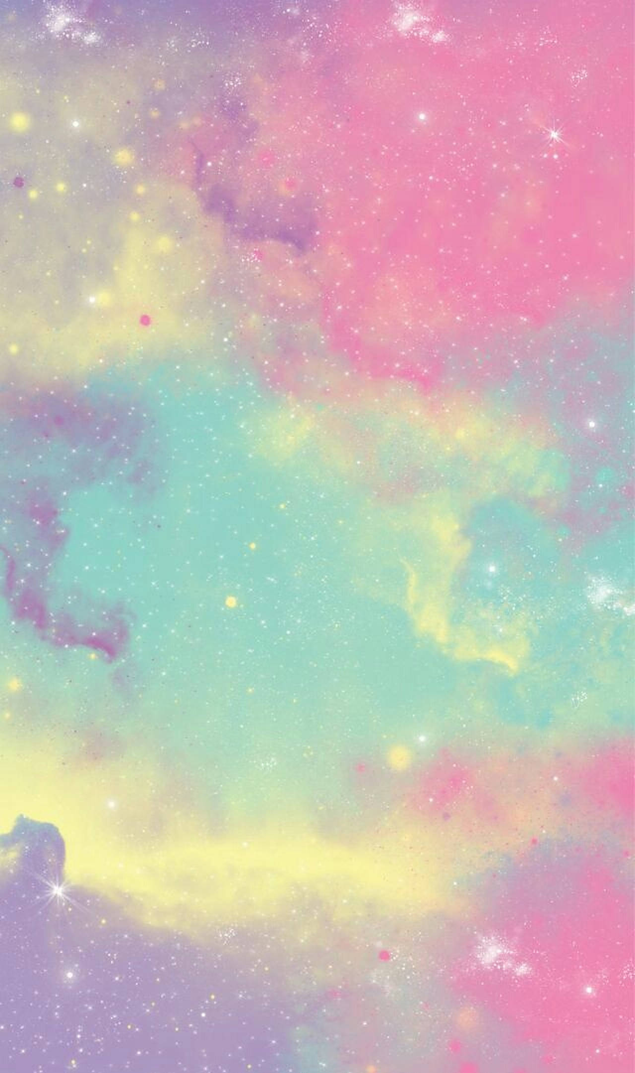 粉彩彩虹 桌布 壁紙 — 夢幻粉彩星系，帶有旋轉的粉紅、藍綠和黃色星雲，點綴著閃爍的星星。