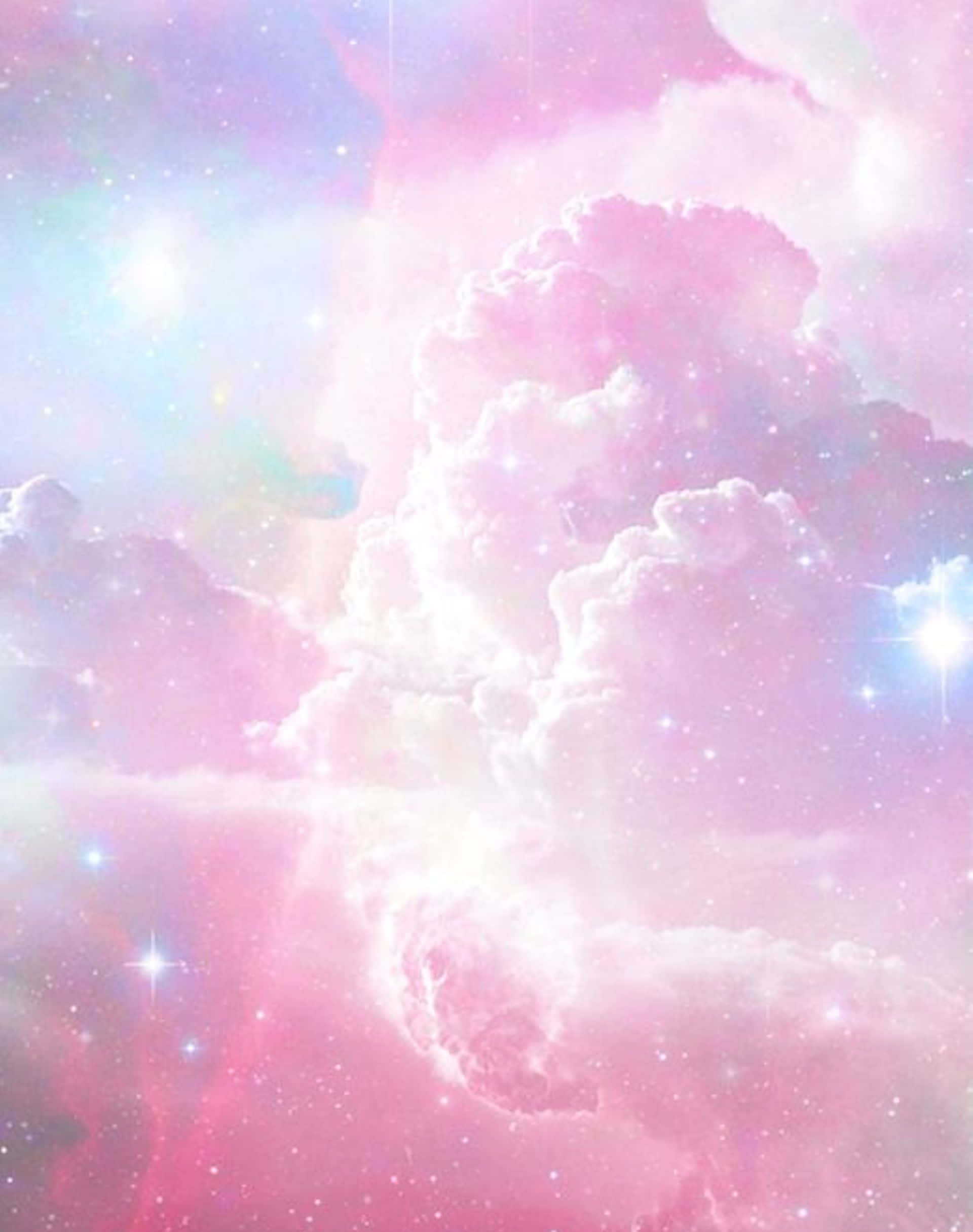Pink Galaxy 桌布 壁紙 — 夢幻般的宇宙天空，充滿柔和的粉紅色和粉彩雲朵，閃爍著星星和耀眼的光束。