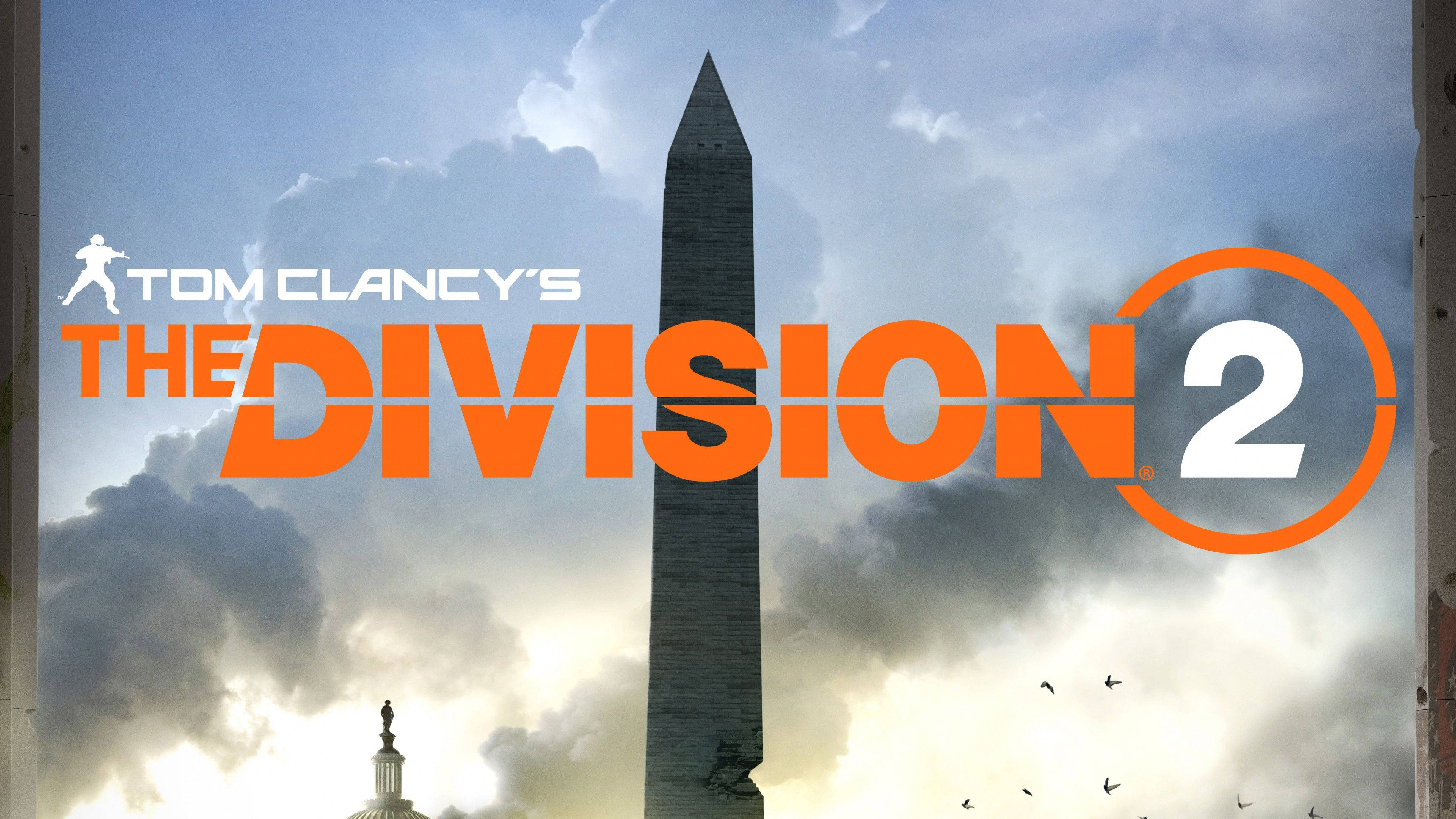 Division 桌布 壁紙 — 大膽橙色的《The Division 2》遊戲標誌覆蓋在華盛頓紀念碑和國會大廈圓頂後方的戲劇性天空上。