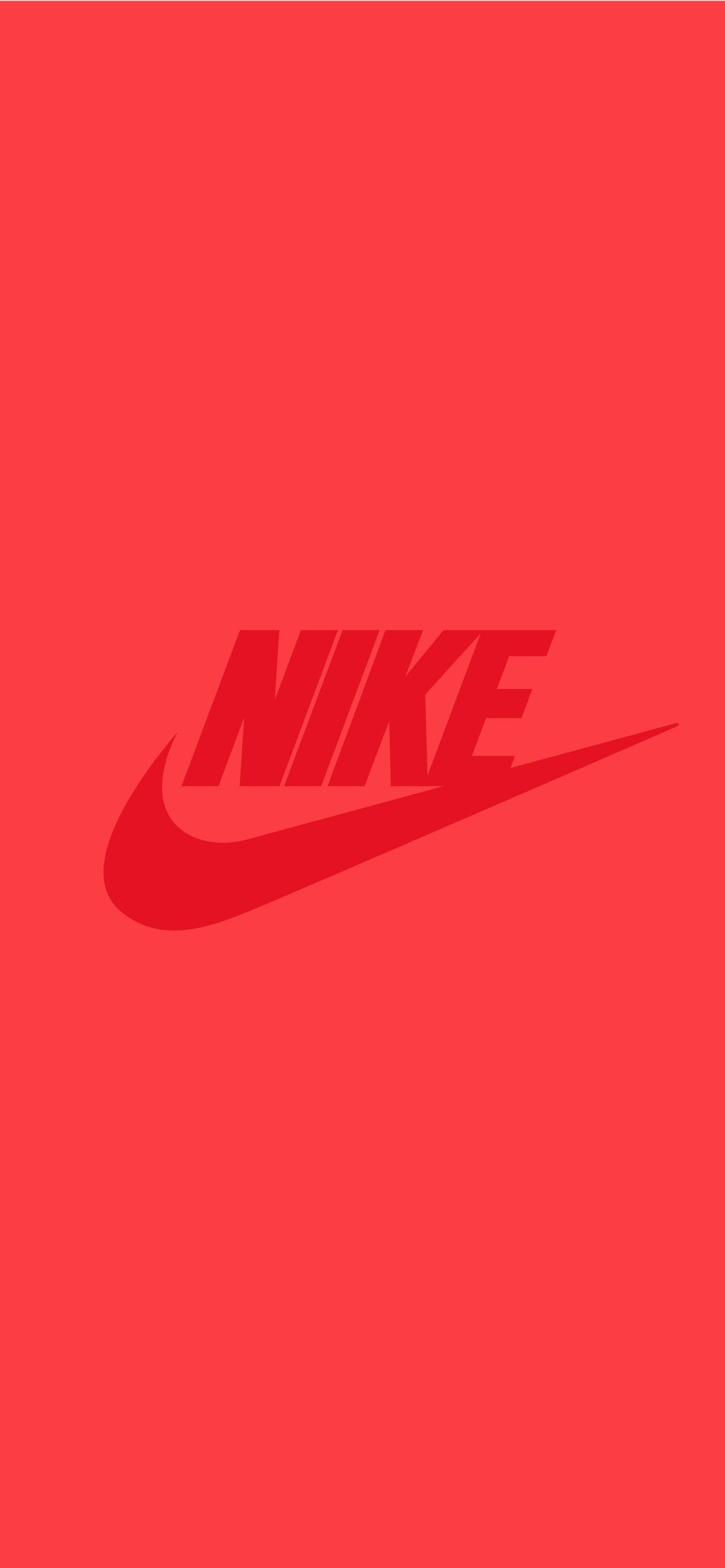 Nike iPhone 桌布 壁紙 — 大膽的Nike標誌以較深紅色居中在純色鮮紅色背景上。
