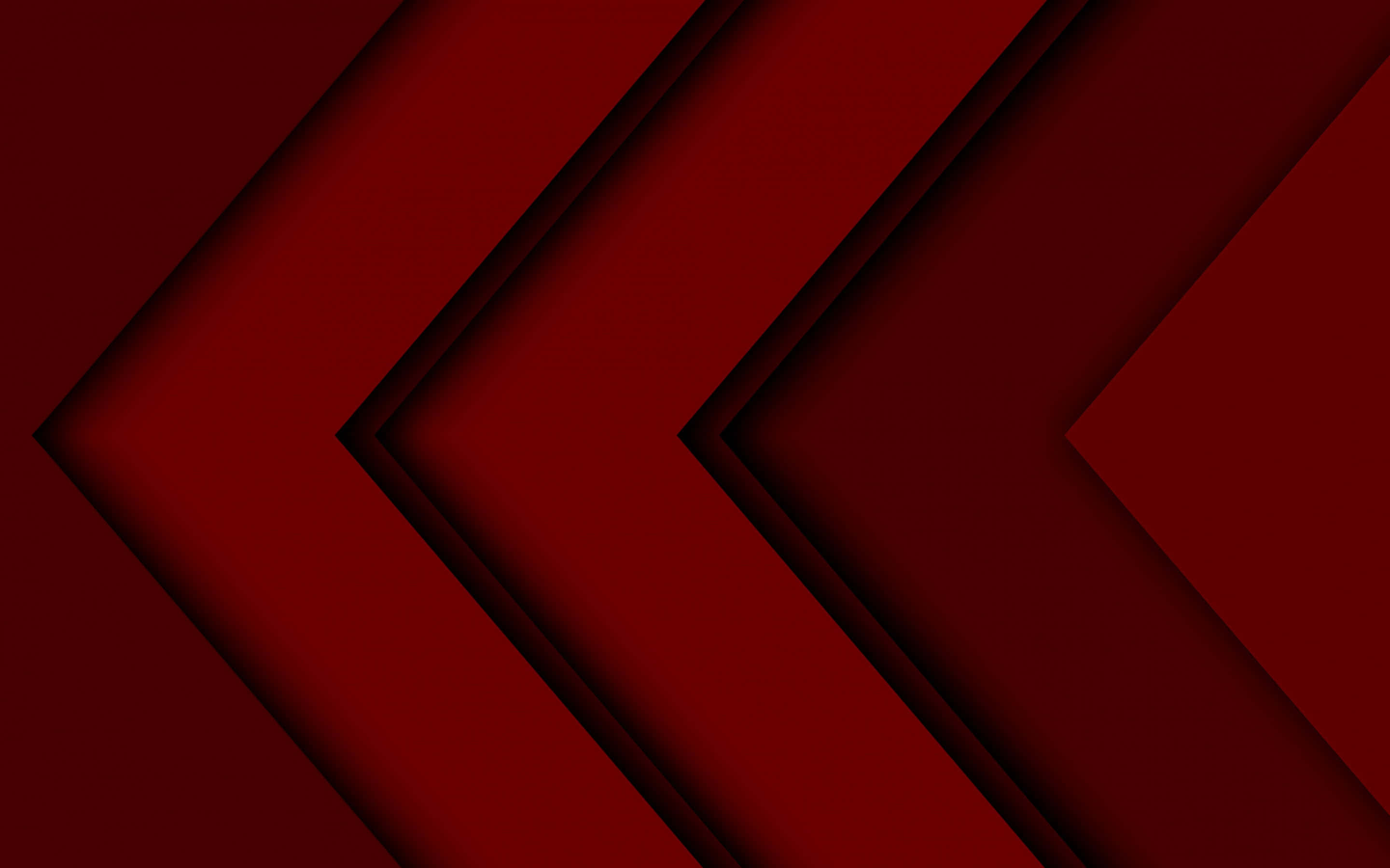 Dark Red Aesthetic 桌布 壁紙 — 大膽的幾何人字形圖案以層疊的深紅色調營造出帶有陰影深度的動態抽象圖案。