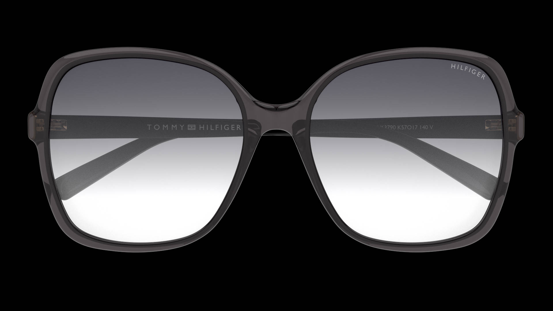 黑色 桌布 壁紙 — 大膽的方形框 Tommy Hilfiger 太陽眼鏡，配備漸層灰色鏡片，襯托純黑背景。