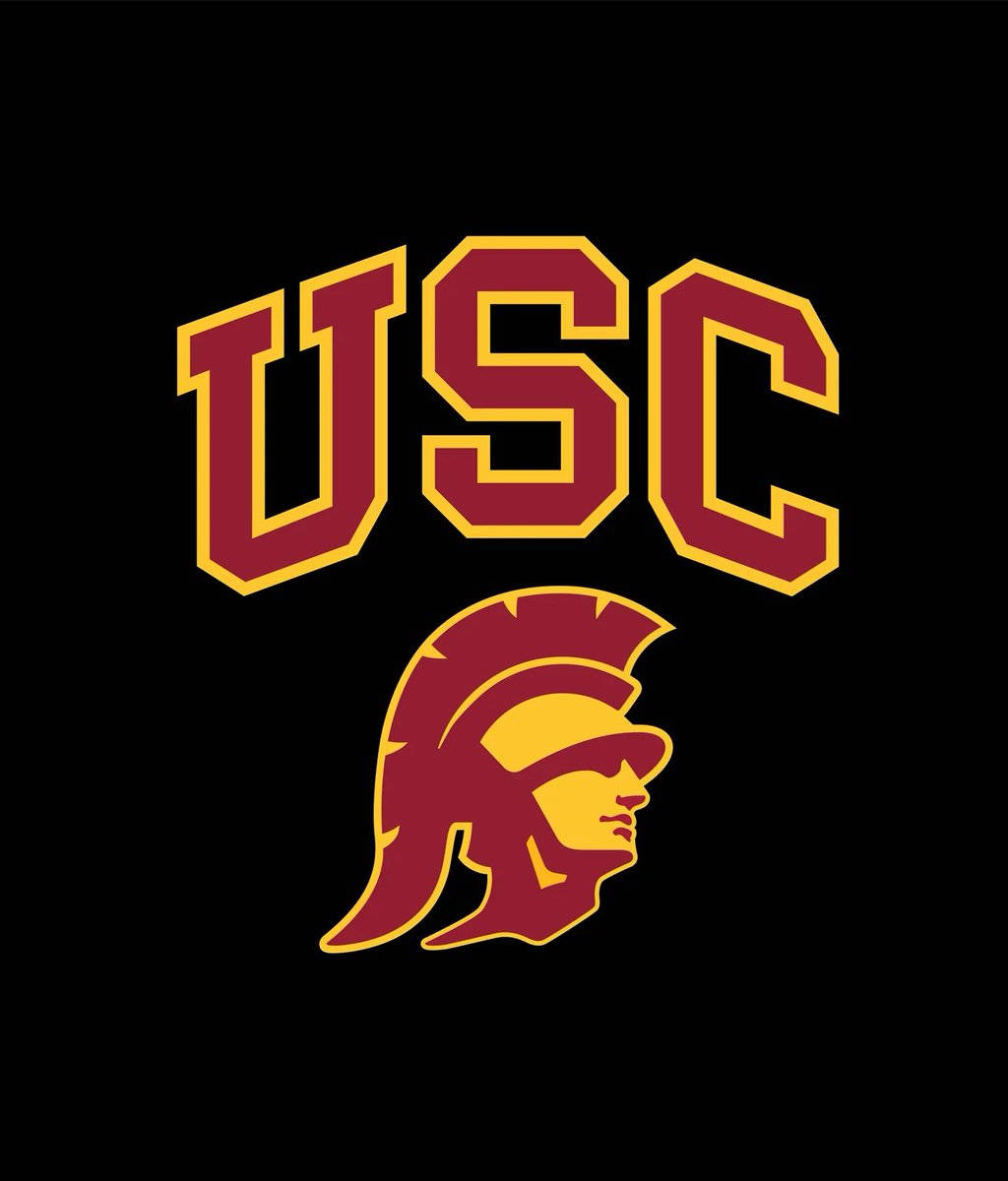 Usc 桌布 壁紙 — 大膽的栗色和金色USC字母在純黑色背景上拱起，覆蓋在特洛伊頭盔標誌之上。