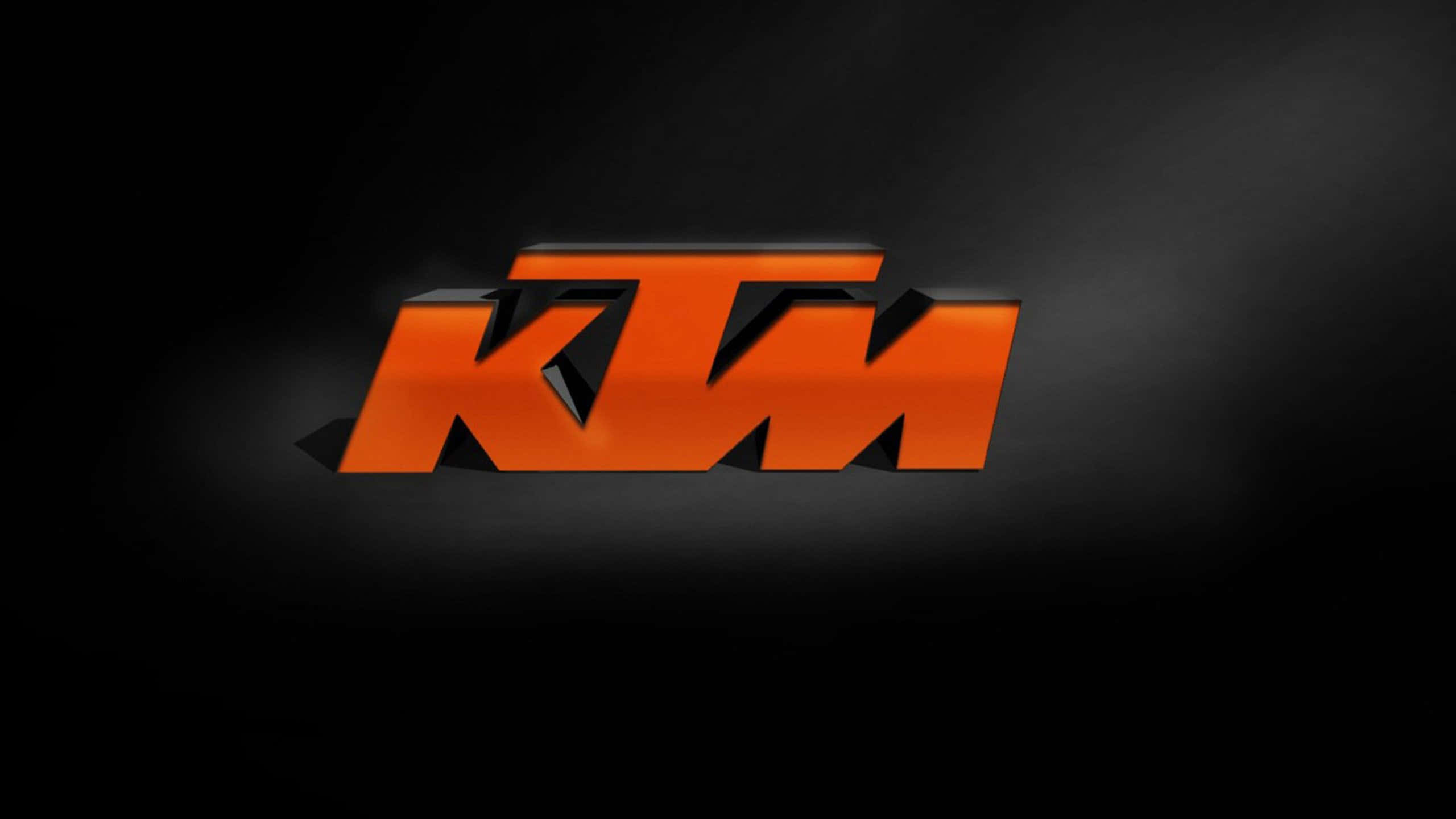深色背景上帶有3D效果的橙色KTM標誌 — Valorant Logo 壁紙