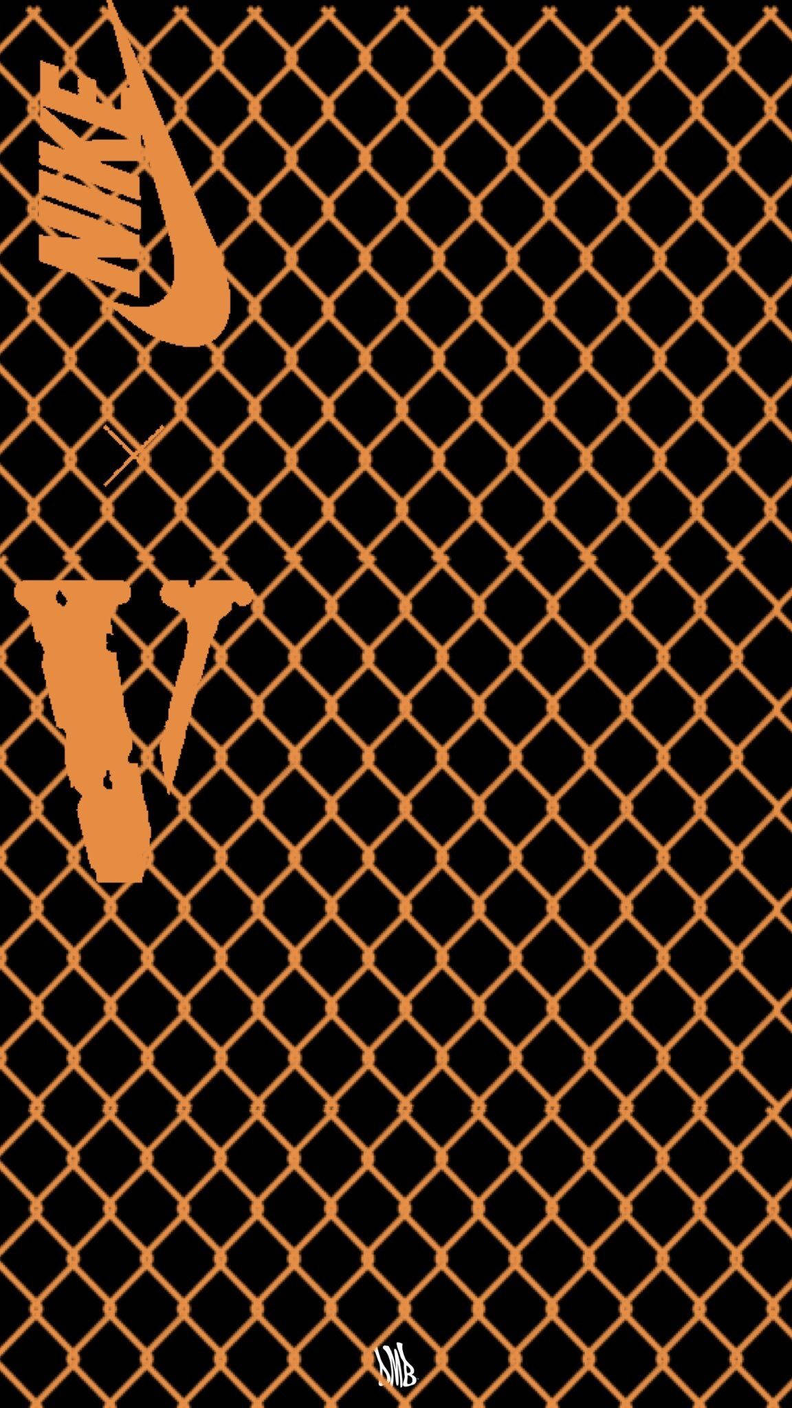Vlone 桌布 壁紙 — 大膽的橙色Nike和V標誌在黑色鐵絲網圖案上脫穎而出，呈現極簡設計。