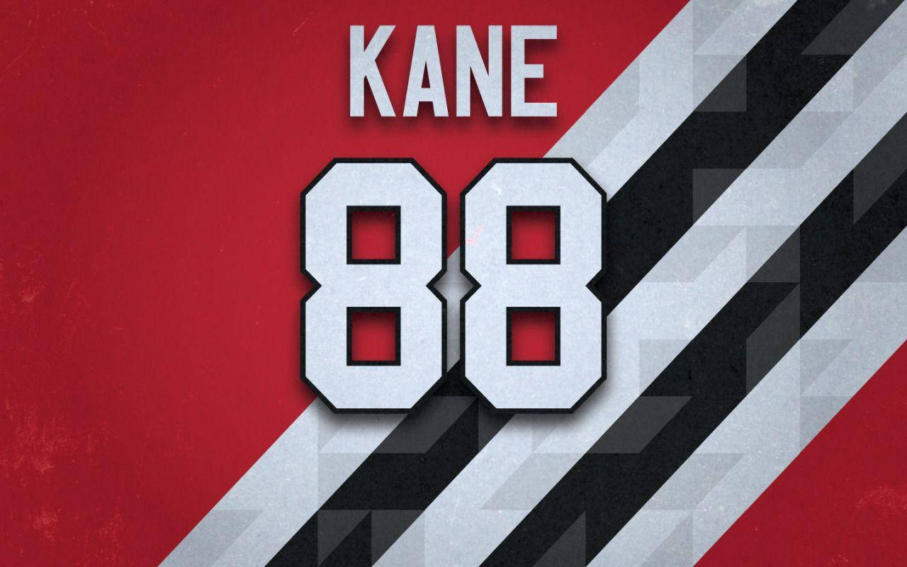運動 桌布 壁紙 — 大膽的白色「KANE 88」球衣文字在動態的紅、黑、灰斜紋背景上脫穎而出。