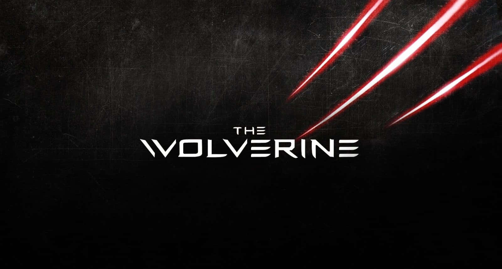 金鋼狼 桌布 壁紙 — 大膽的白色「The Wolverine」標題在粗糙的黑色背景上發光，背景被三條鮮紅色的爪痕劃破。