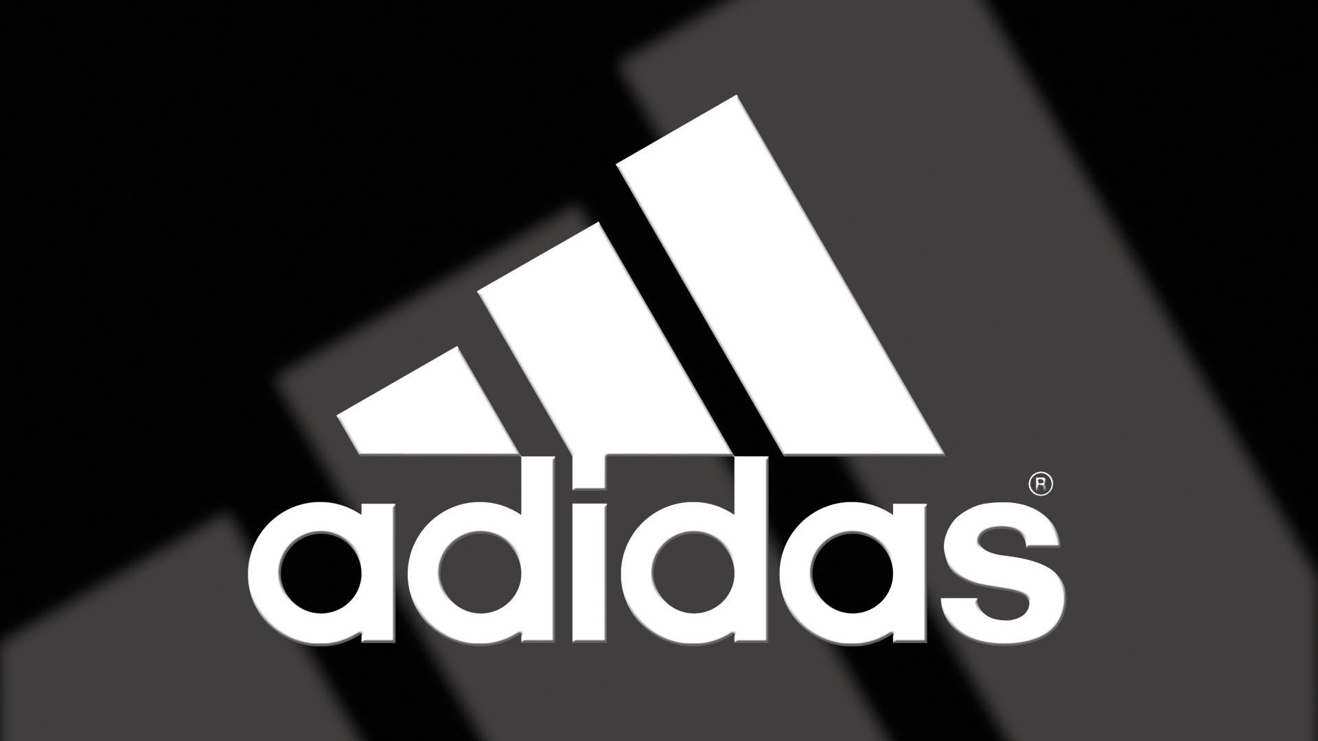 愛迪達 桌布 壁紙 — 大膽的白色adidas標誌在時尚的黑灰幾何背景上脫穎而出。