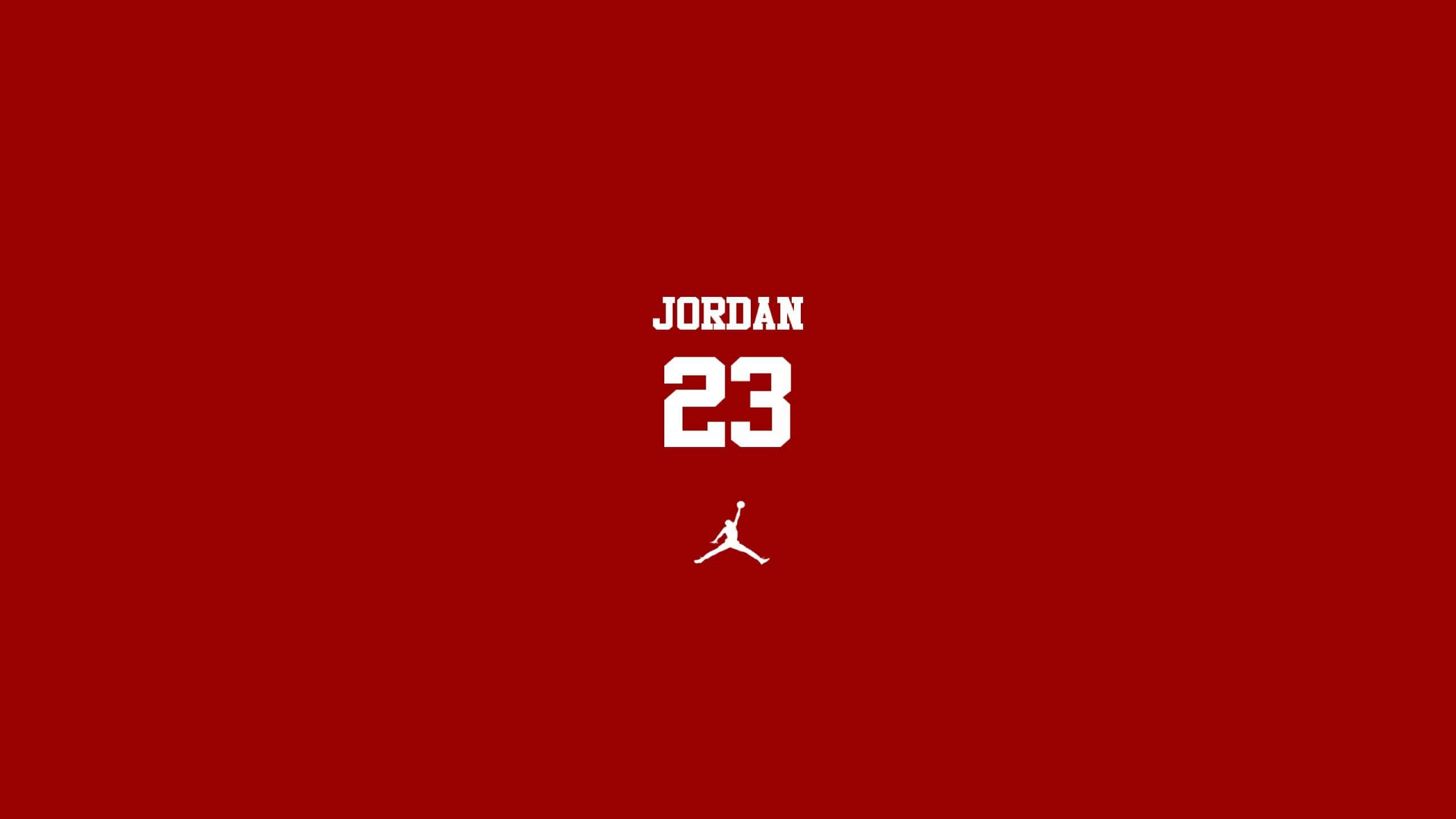Jordan 桌布 壁紙 — 大膽的白色Jordan 23標誌和剪影居中在純紅色背景上。