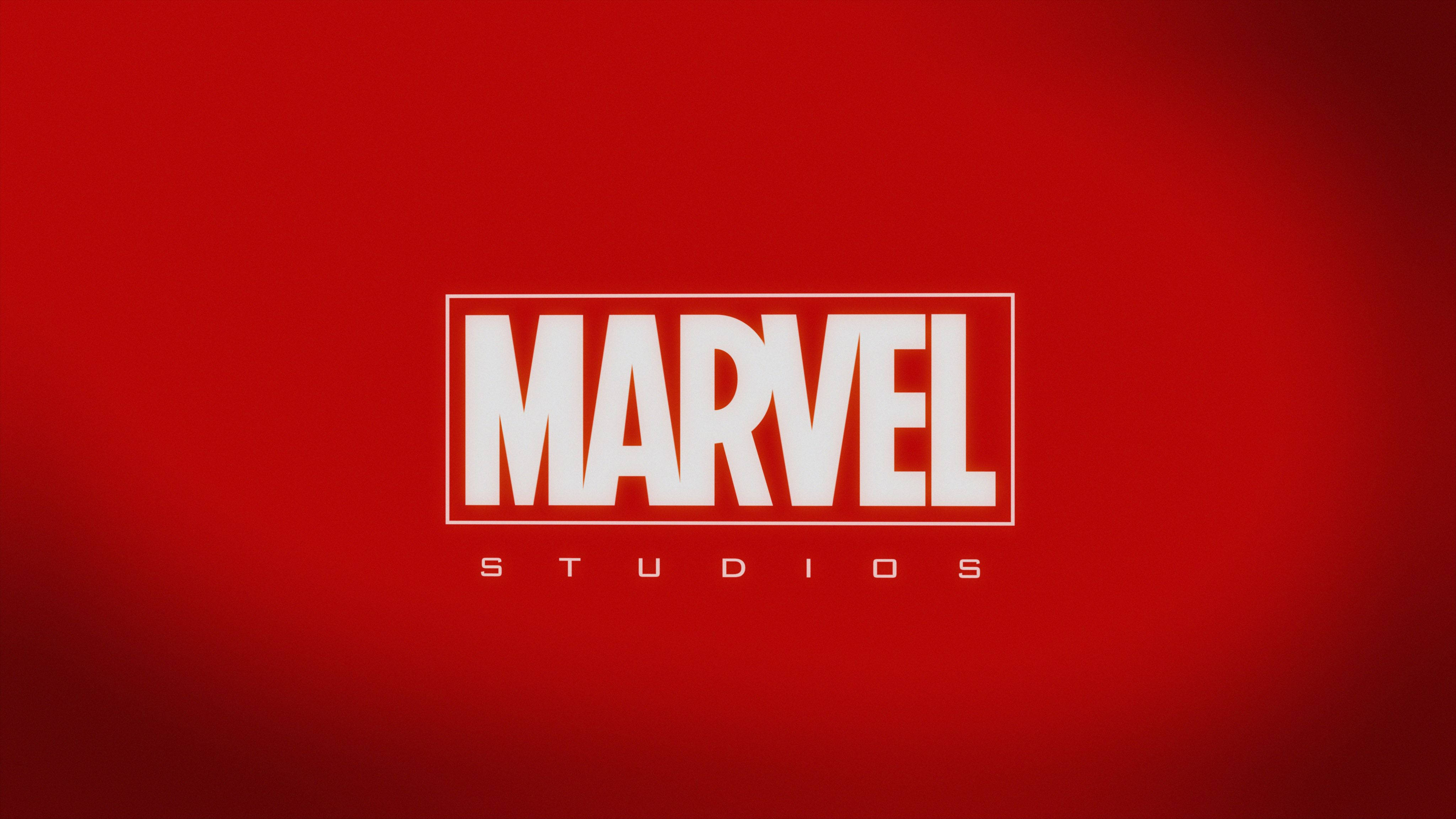 漫威 桌布 壁紙 — 大膽的白色Marvel Studios標誌居中在豐富的紅色漸變背景上。