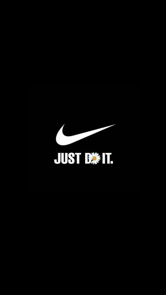 Nike 桌布 壁紙 — 大膽的白色Nike勾勾和「JUST DO IT.」文字，以雛菊取代「O」，背景為純黑色。