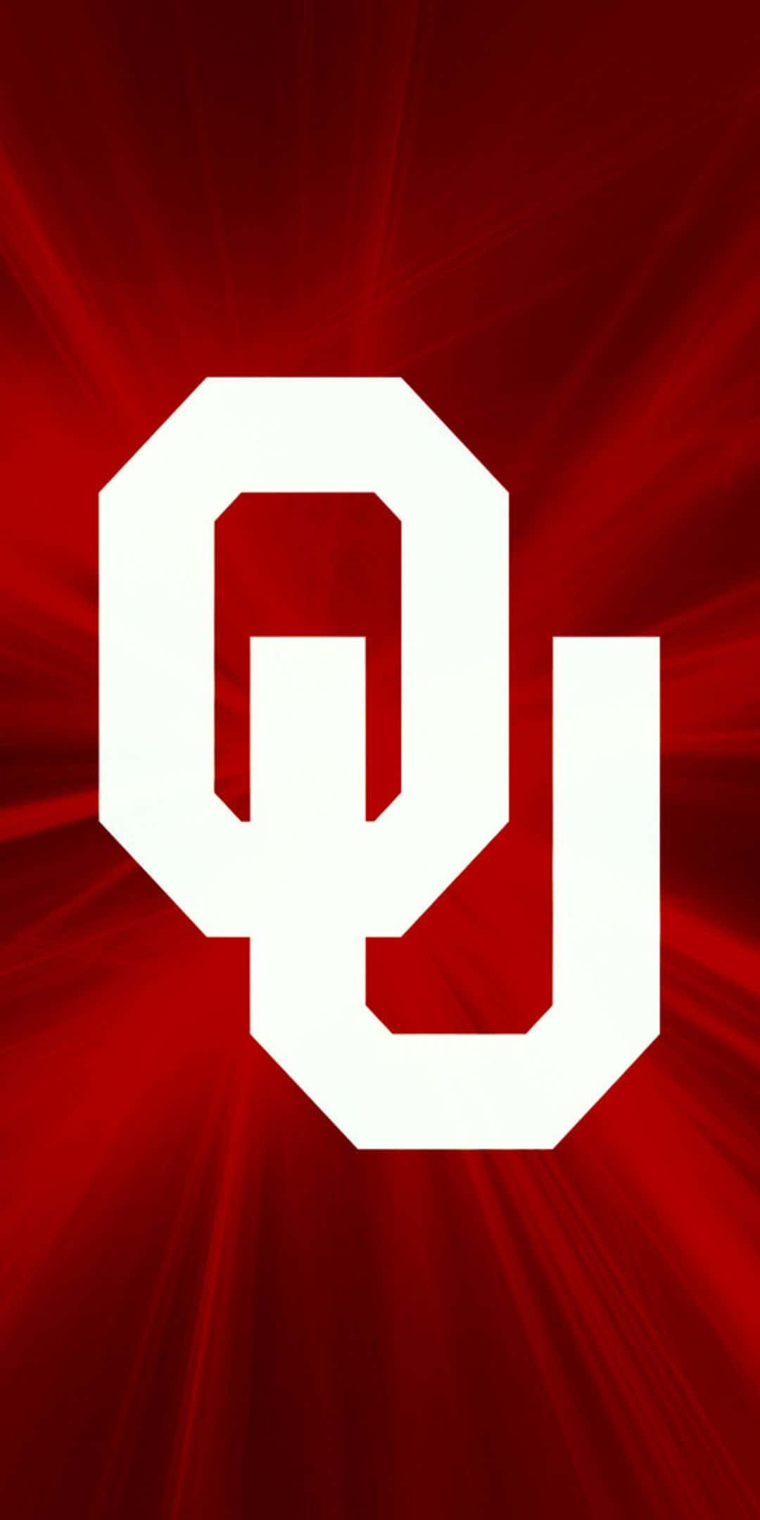 Oklahoma 桌布 壁紙 — 大膽的白色OU標誌置於鮮紅色背景中央，帶有放射狀光線。