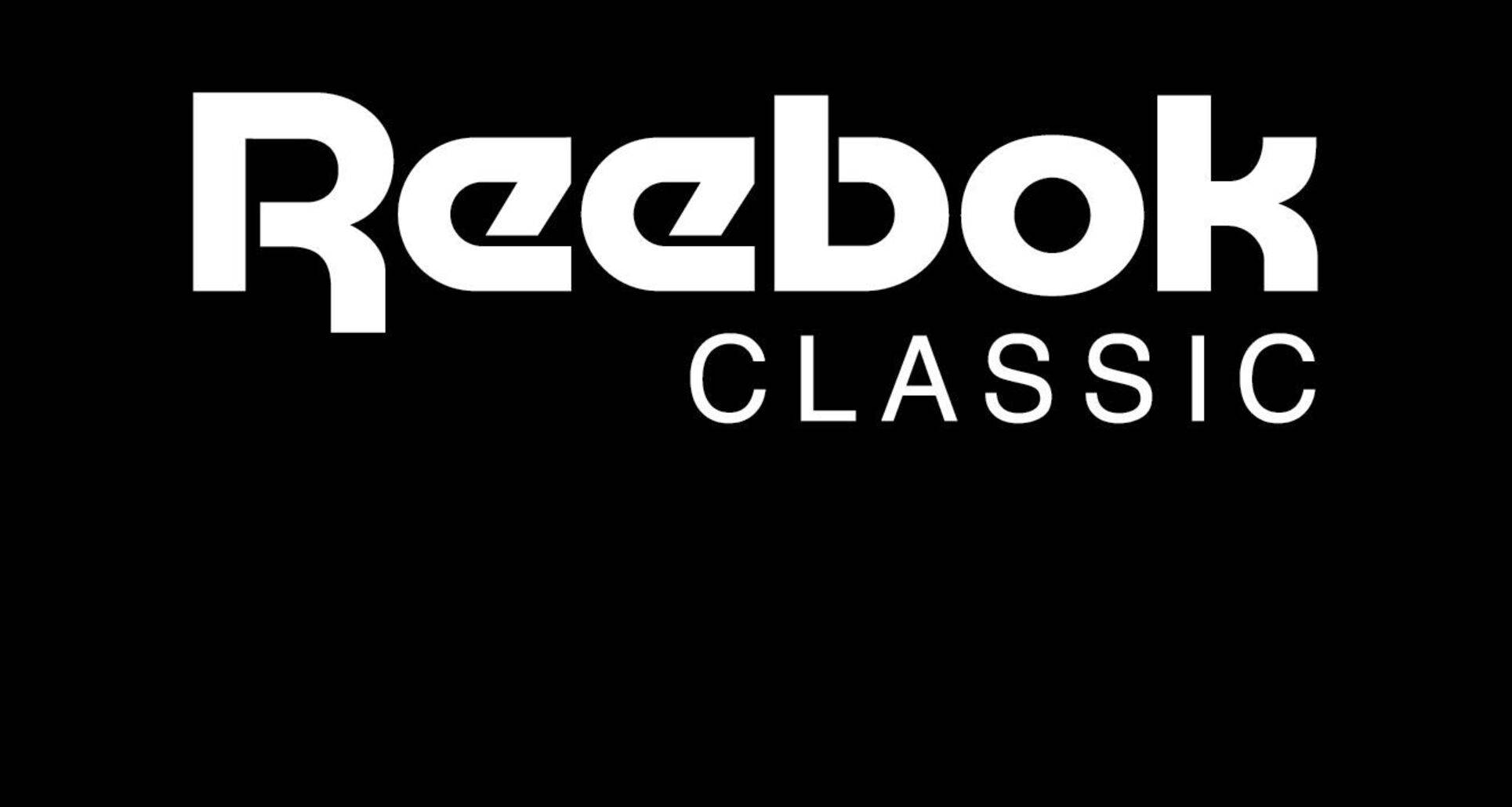 Reebok 桌布 壁紙 — 大膽的白色Reebok Classic標誌置於純黑色背景中央，搭配簡潔極簡字體。