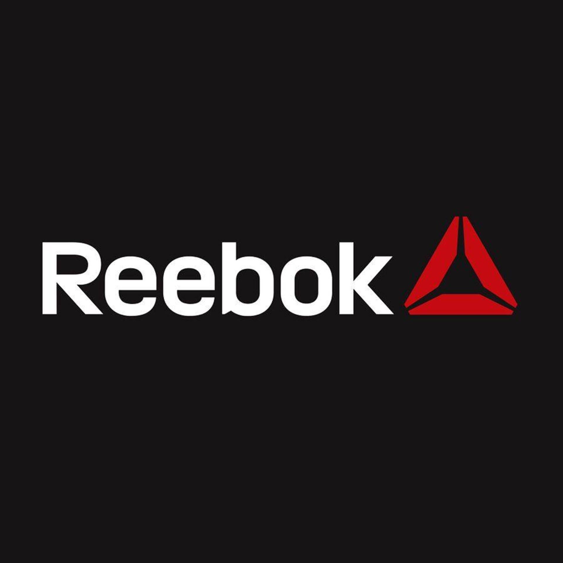 Reebok 桌布 壁紙 — 大膽的白色Reebok標誌，帶有紅色三角形，位於純黑色背景上。
