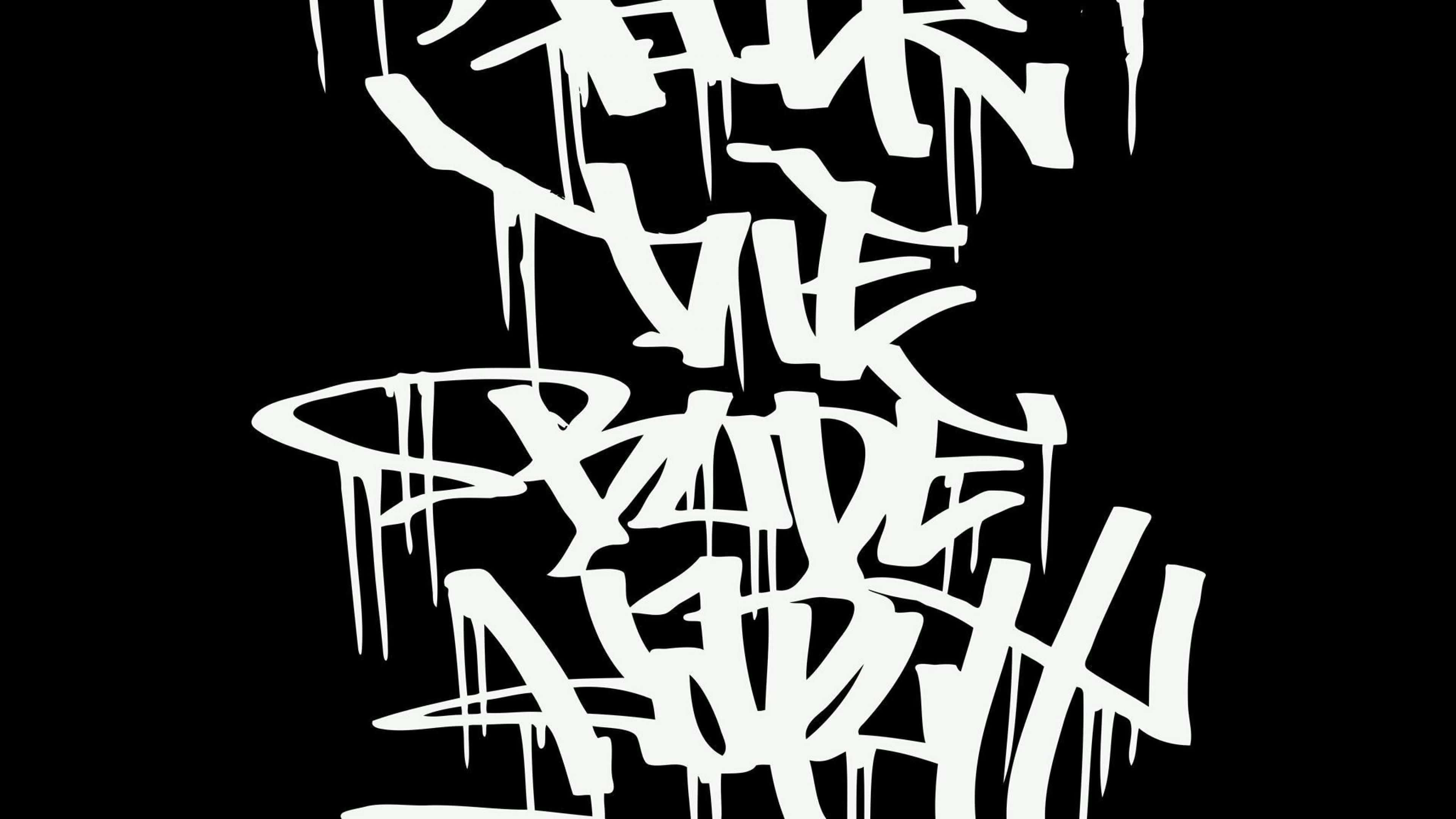 Black And White Graffiti 桌布 壁紙 — 大膽的白色塗鴉字母在漆黑的背景上滴落，呈現混亂的城市街頭藝術風格。