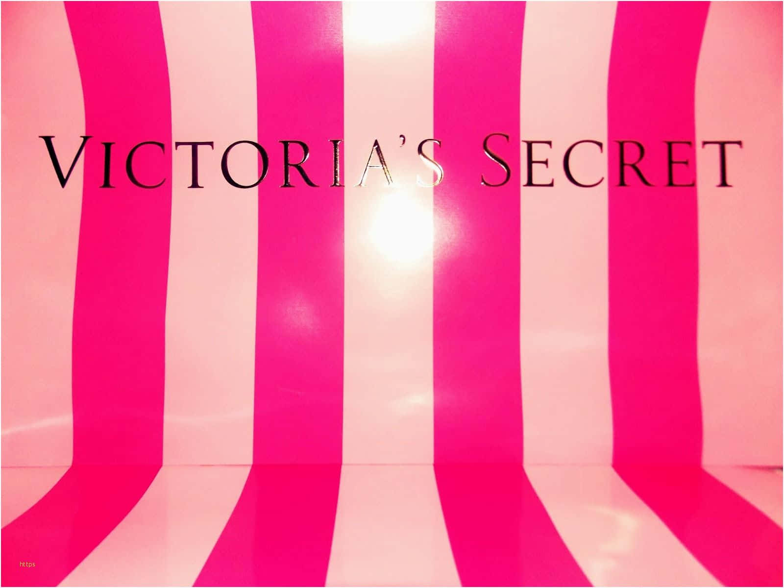 維多利亞的秘密 桌布 壁紙 — 大膽的粉紅和白色垂直條紋為 Victoria's Secret 標誌創造了充滿活力、光澤的背景。