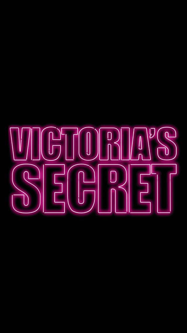 victoria 桌布 壁紙 — 大膽的粉紅色霓虹燈文字拼出Victoria's Secret，在純黑色背景上發光。