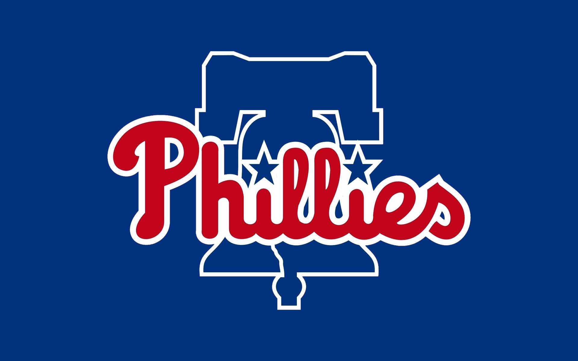 Philadelphia 桌布 壁紙 — 大膽的紅色 Phillies 字體，帶有白色輪廓和藍色星星，置於純皇家藍色背景上。
