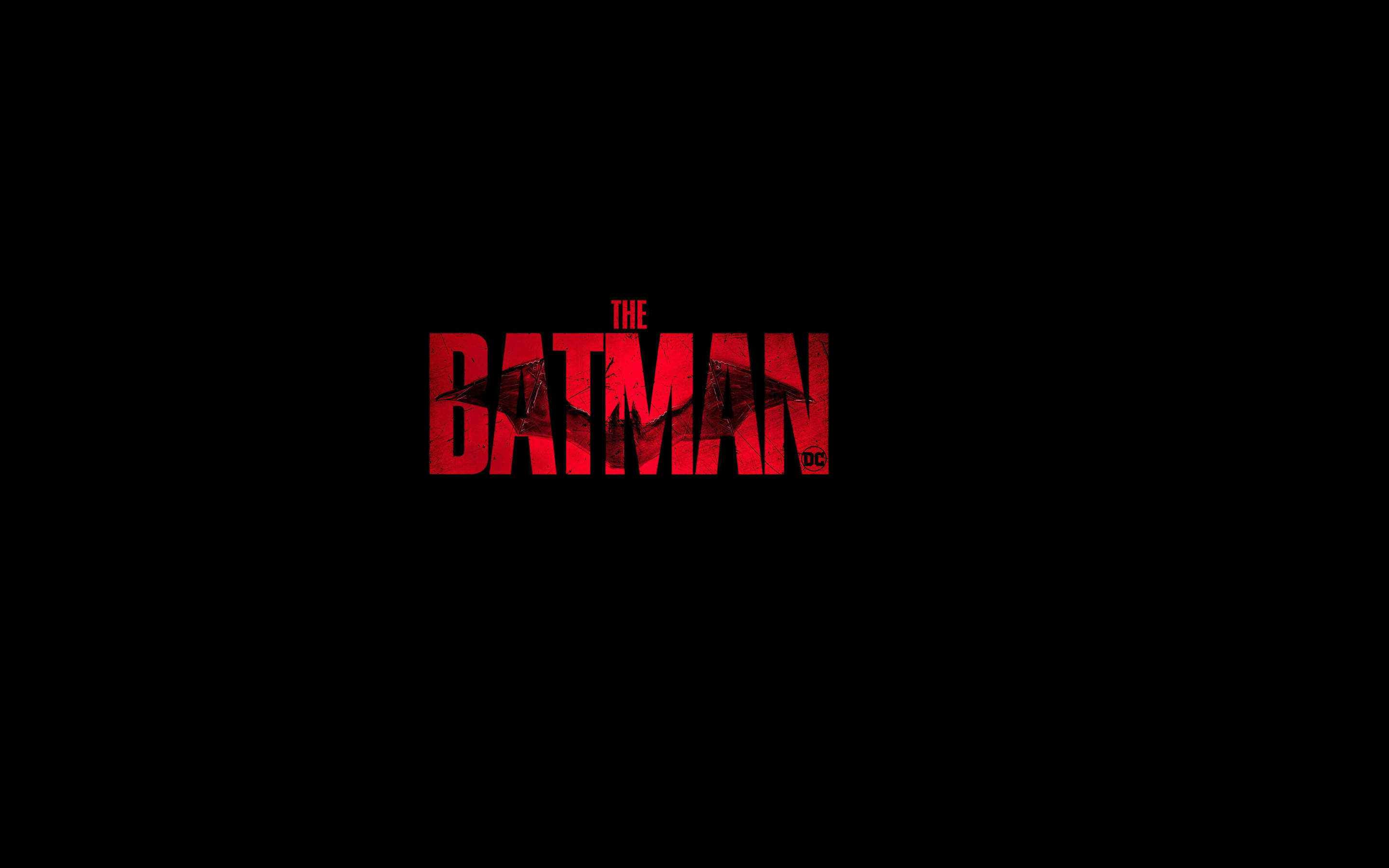 蝙蝠俠 桌布 壁紙 — 大膽的紅色「The Batman」標誌，蝙蝠剪影在純黑背景上。