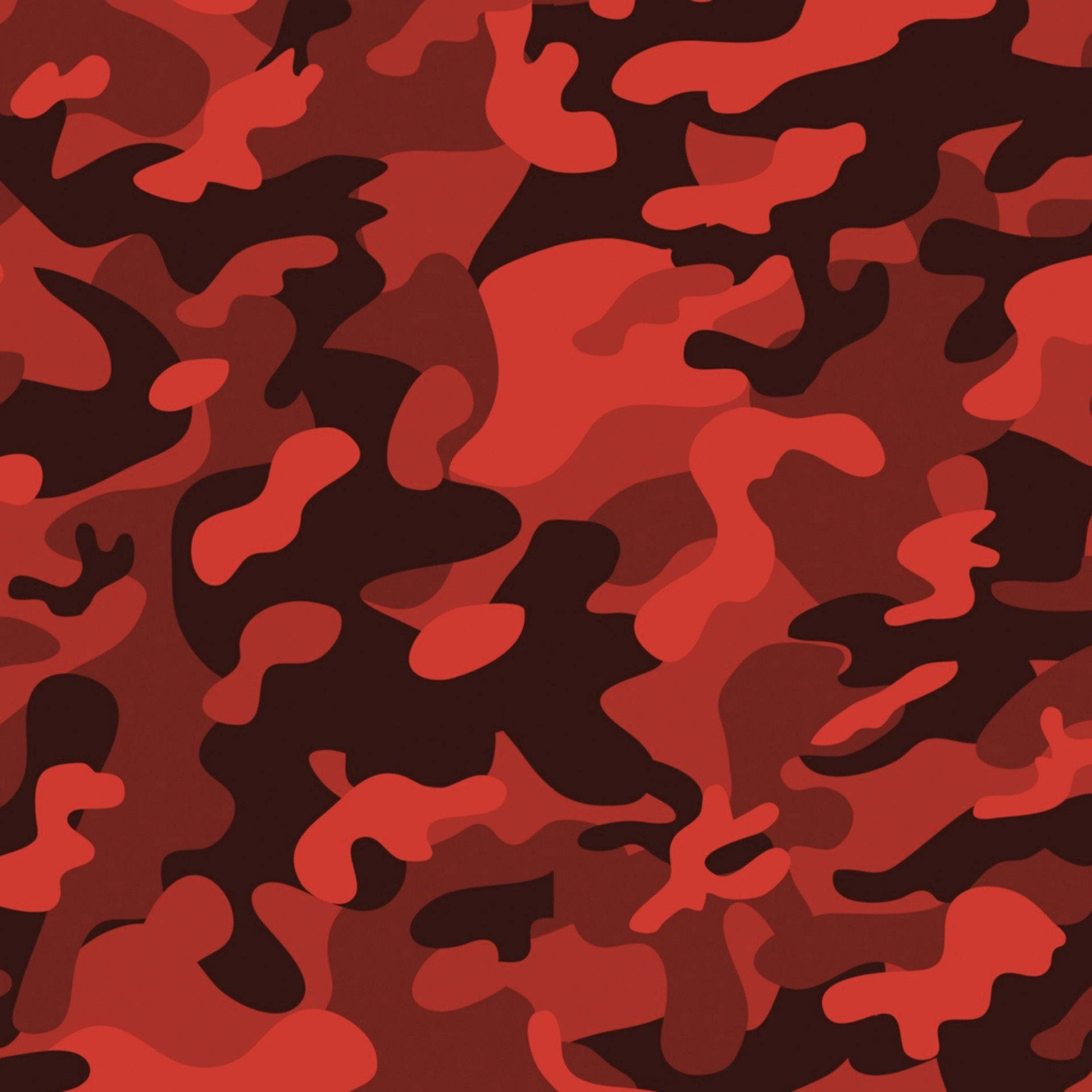 Red Camo 桌布 壁紙 — 大膽的紅色和深棕色迷彩圖案，不規則的有機形狀重複貫穿整個畫面。