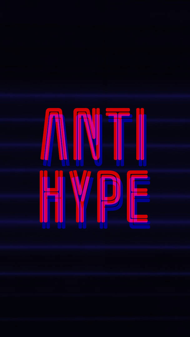 Neon Pink 桌布 壁紙 — 大膽的紅色和藍色霓虹燈文字「anti hype」在帶有水平光線的黑暗背景中發光。