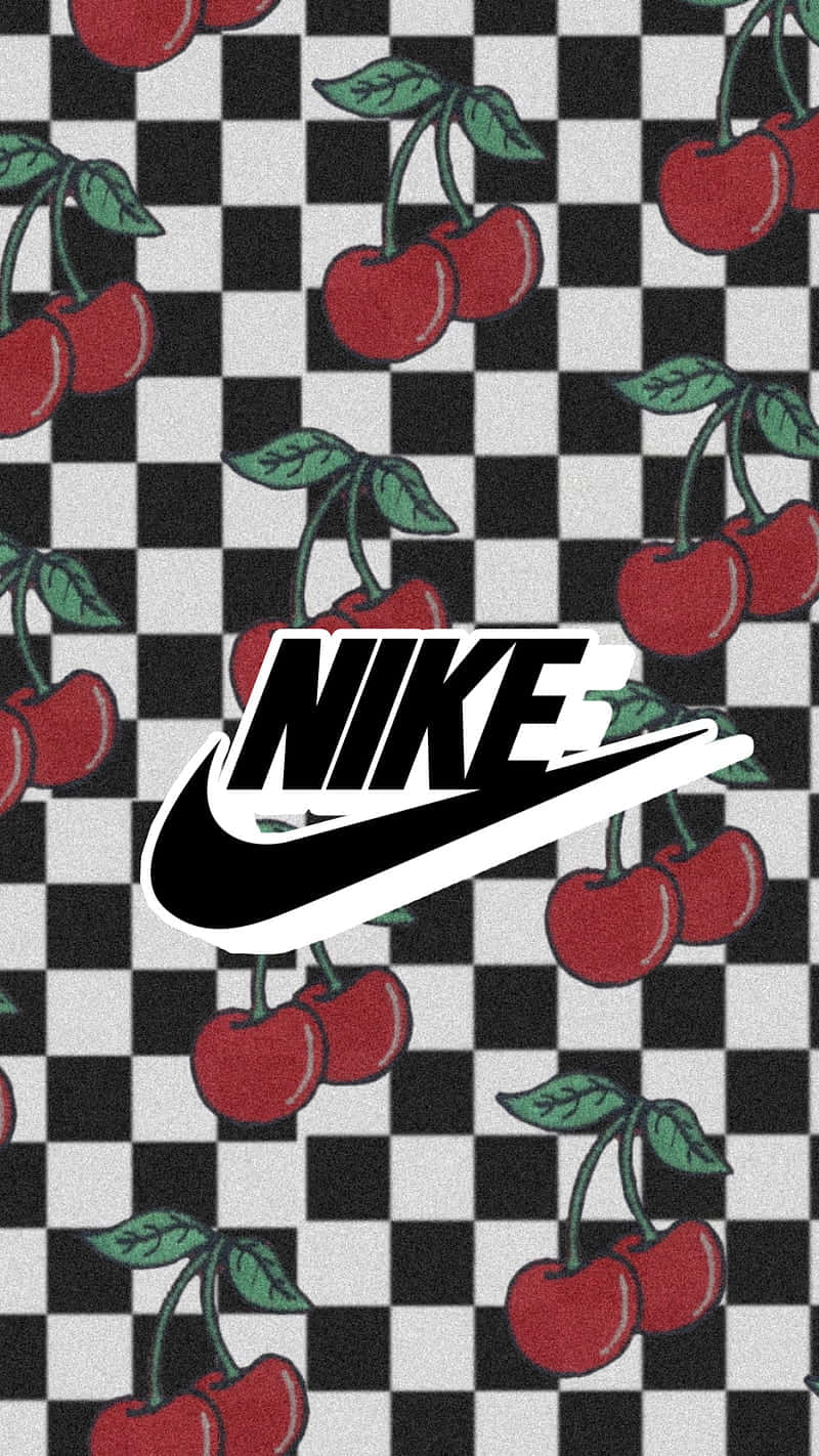 nike girl 桌布 壁紙 — 大膽的紅色櫻桃和綠色葉子在黑白棋盤格圖案上重複，中央有Nike標誌。