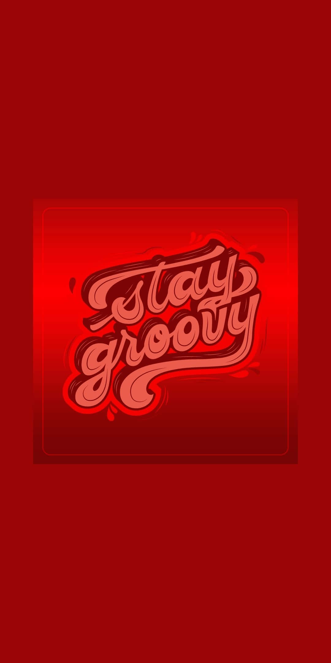 Typography 桌布 壁紙 — 大膽的紅色背景，帶有發光霓虹風格的「Stay Groovy」文字，採用復古手寫字體並帶有分層陰影。