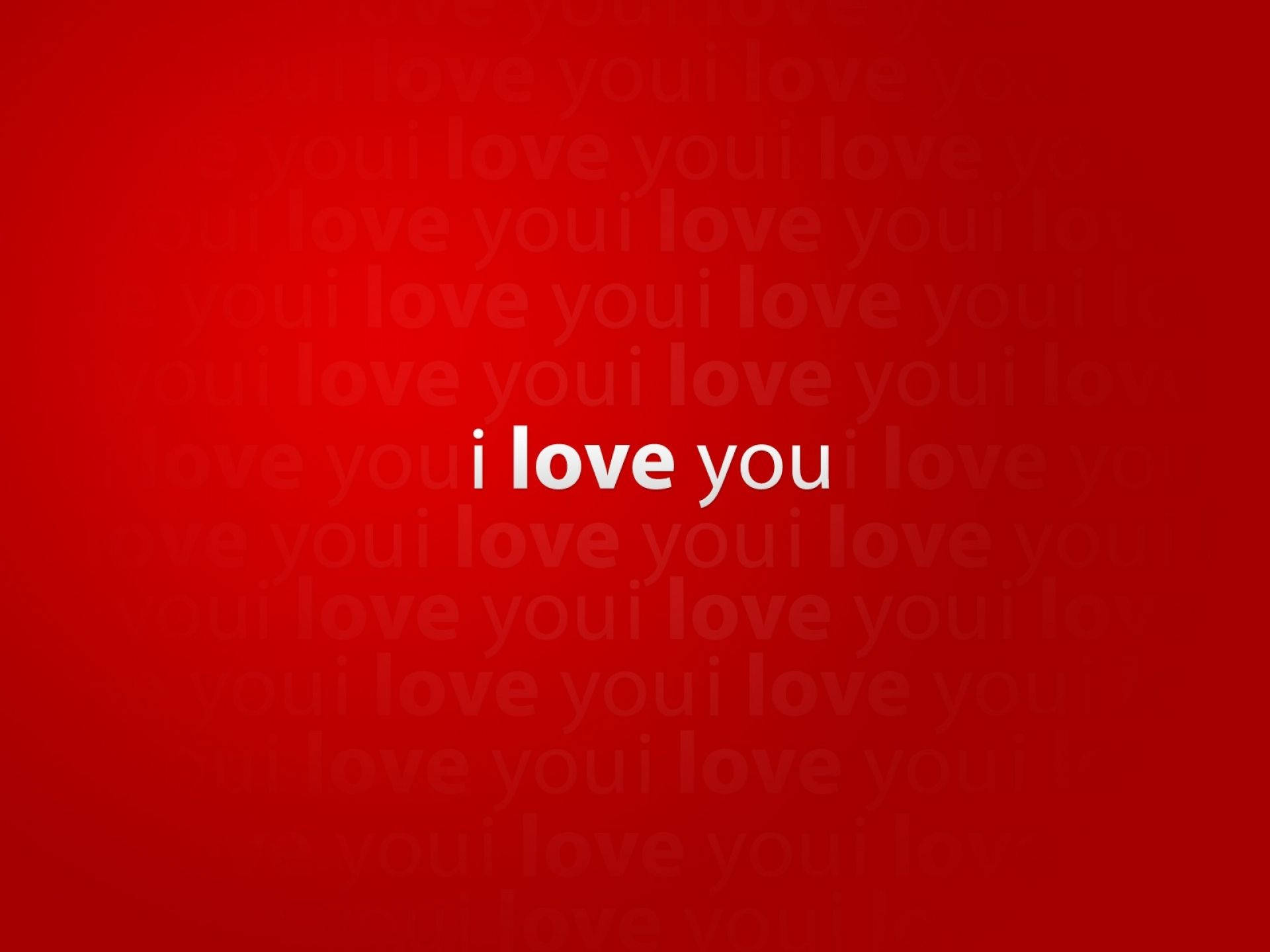 I Love You Aesthetic 桌布 壁紙 — 大膽的紅色背景，帶有重複的微弱「我愛你」文字和中央的白色「我愛你」短語。