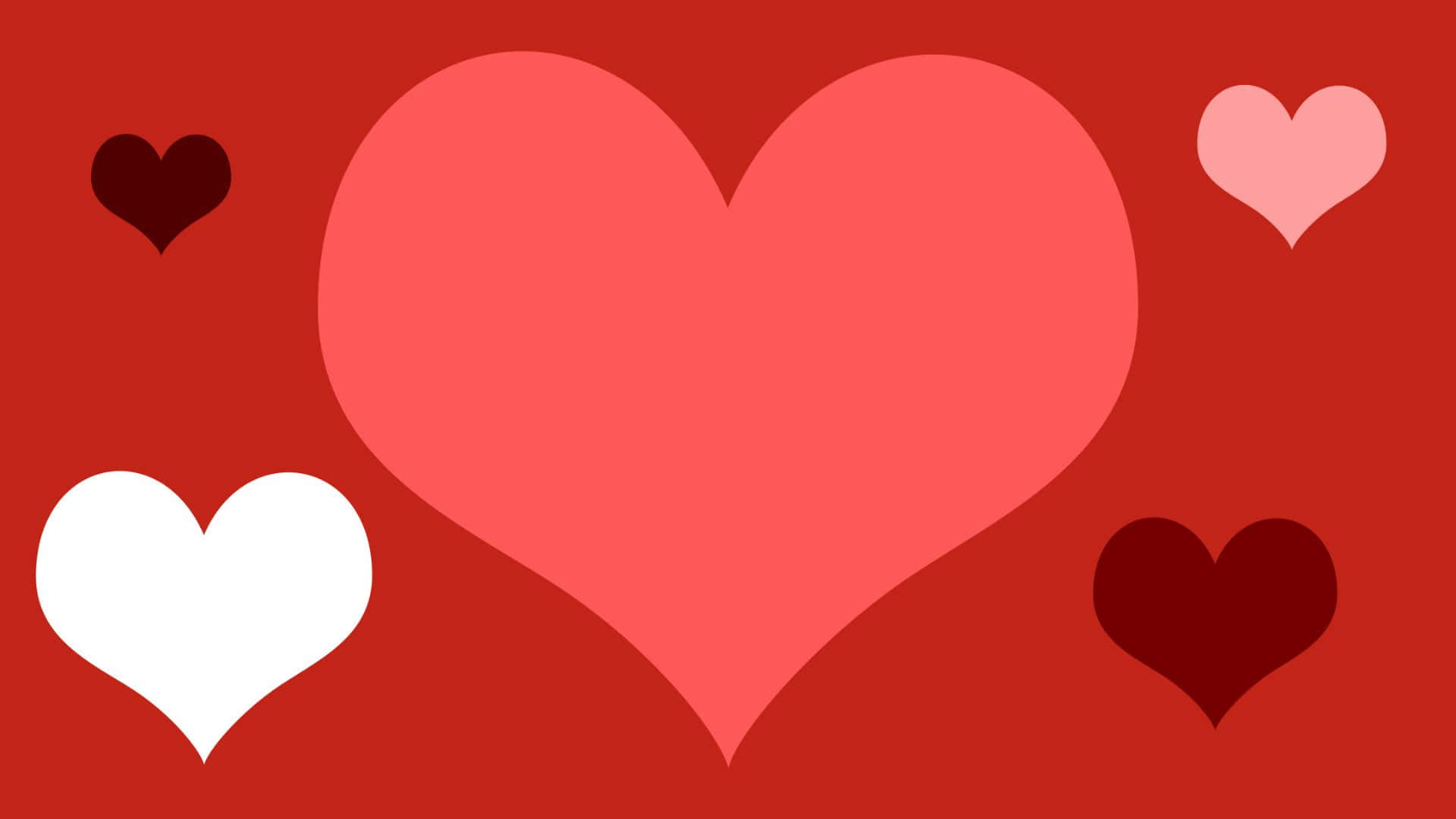 Red Hearts 桌布 壁紙 — 大膽的紅色背景上有一個大的珊瑚心，周圍環繞著白色和深紅色的小心。