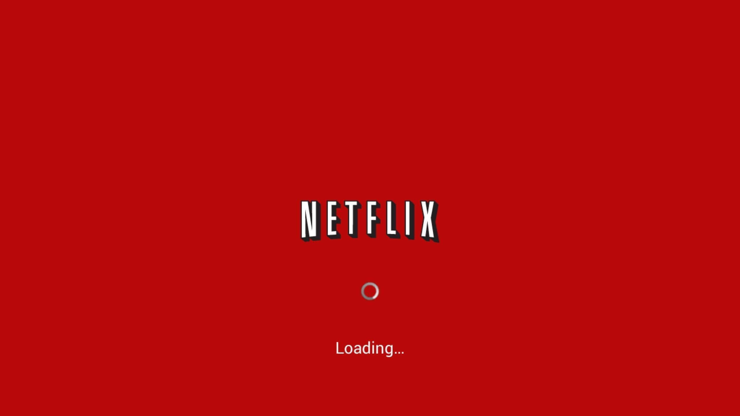 Netflix 桌布 壁紙 — 大膽的紅色背景展示Netflix標誌和一個載入旋轉器，並帶有文字Loading...