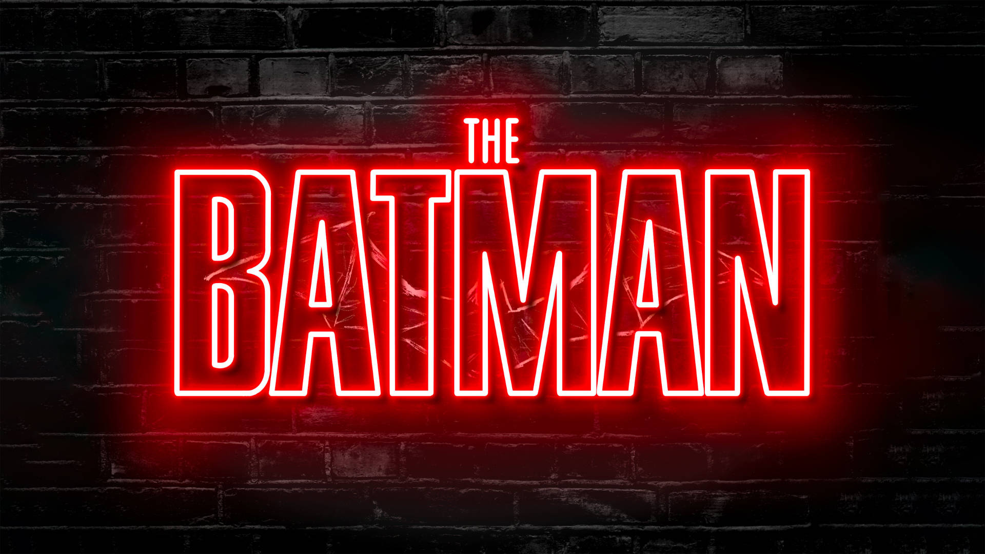 The Batman 桌布 壁紙 — 大膽的紅色霓虹燈牌拼出「THE BATMAN」，在深色紋理磚牆上發光。