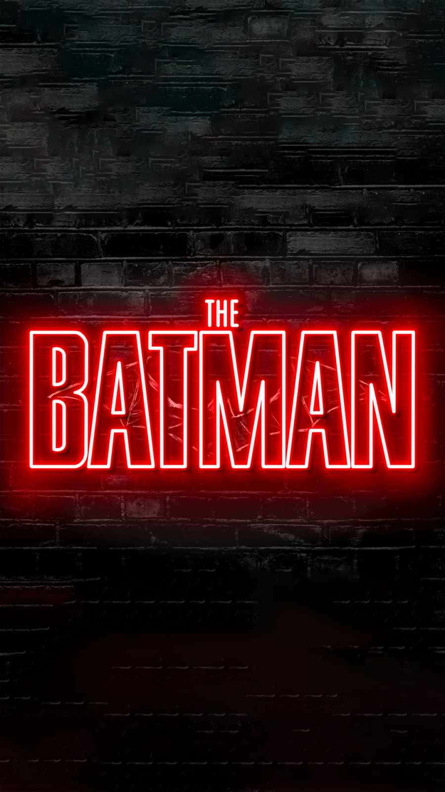 桌布 壁紙 — 大膽的紅色霓虹燈牌拼寫著「THE BATMAN」，在黑暗粗糙的磚牆上發光，營造出 gritty 的城市氛圍。