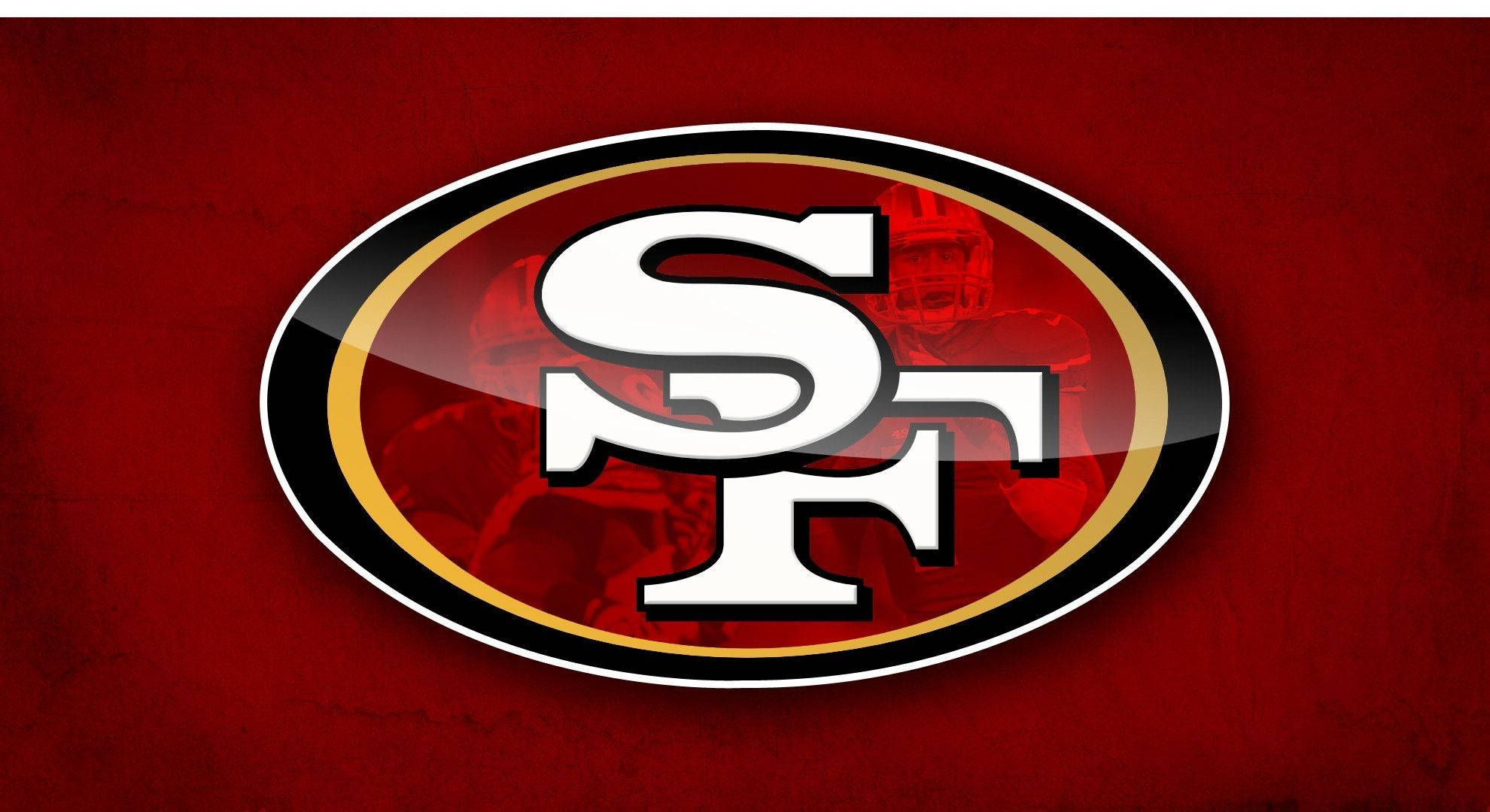 49ers 桌布 壁紙 — 大膽的舊金山49人隊標誌，白色SF字母在橢圓形內，置於有紋理的紅色背景上。