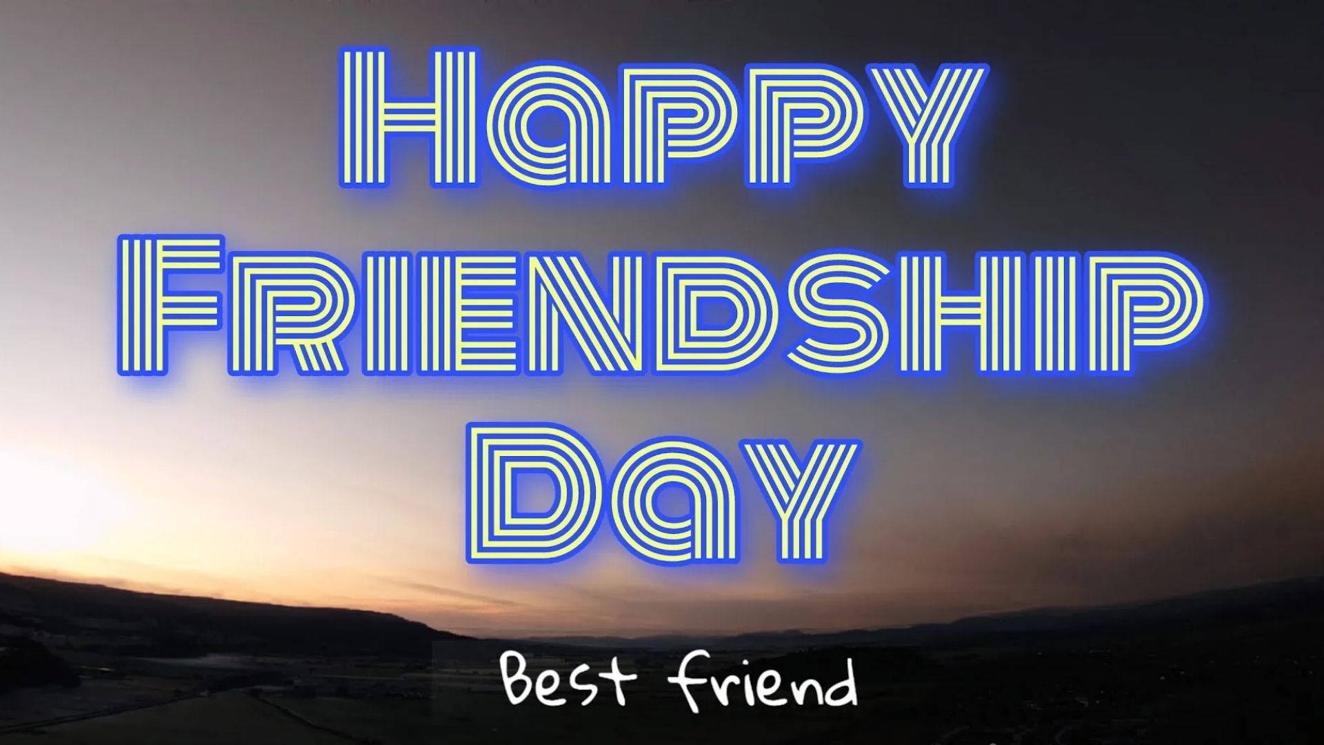 友誼日 桌布 壁紙 — 大膽的藍色霓虹燈文字 'HAPPY FRIENDSHIP DAY' 在起伏山丘上的暮色天空中閃耀。