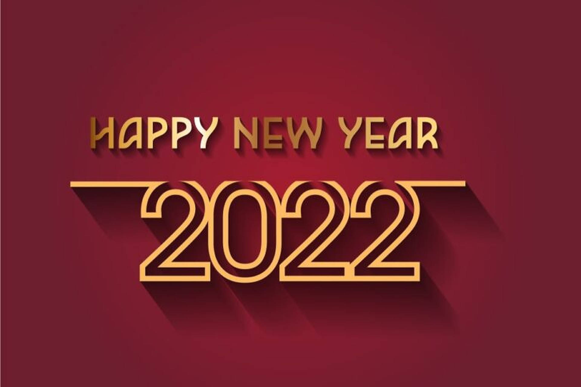 New 桌布 壁紙 — 大膽的金色「Happy New Year 2022」文字在濃郁的酒紅色背景上投下長長的陰影。
