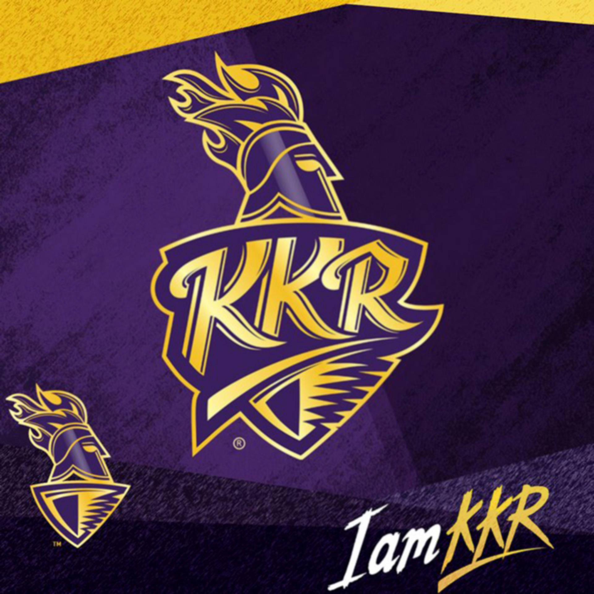 Riders 桌布 壁紙 — 大膽的金色KKR標誌，帶有火焰頭盔，位於紋理紫色背景上，配有較小的徽章和「I am KKR」標語。