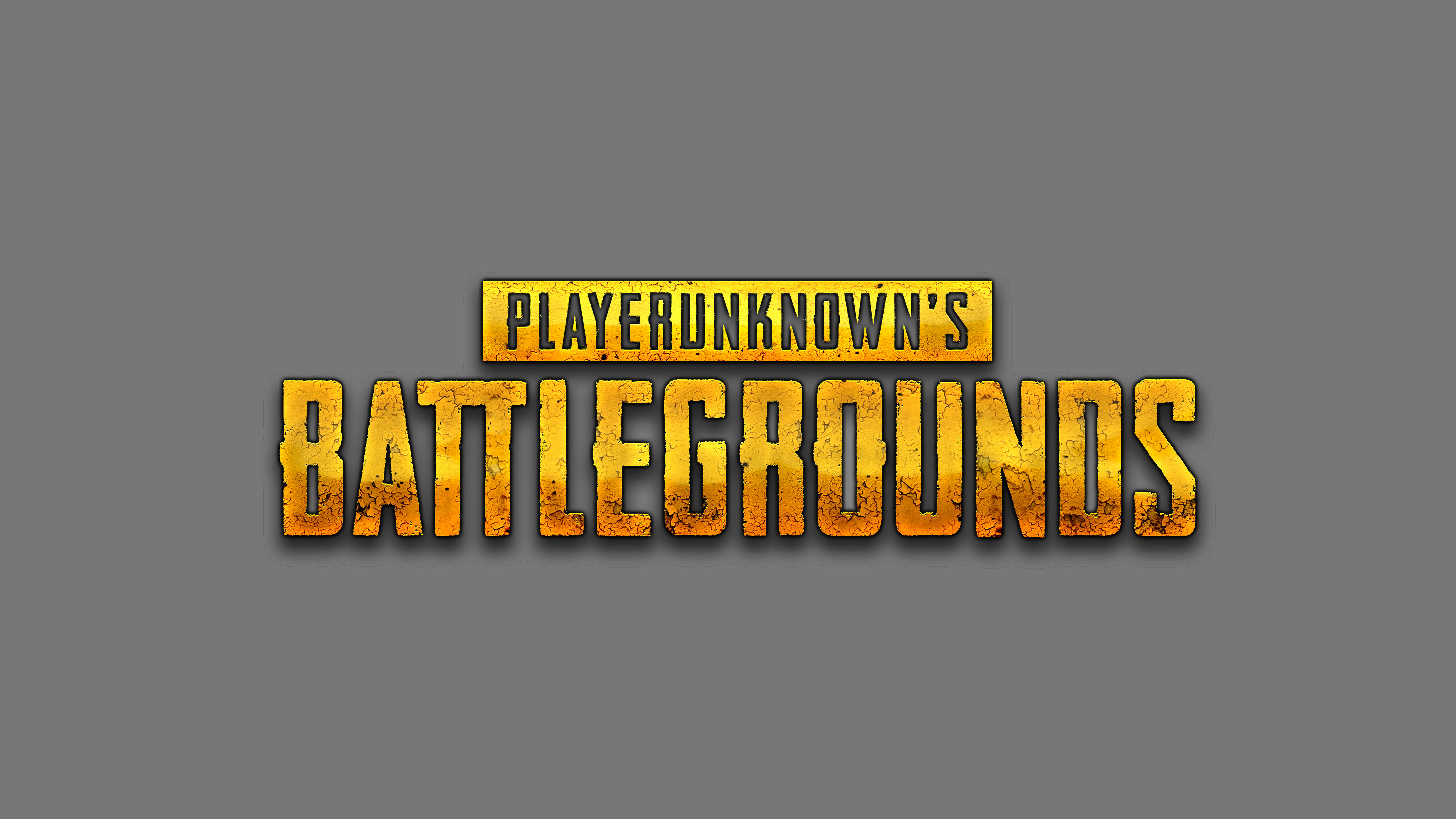 Pubg Logo 桌布 壁紙 — 大膽的金色紋理PUBG標誌，置於純灰色背景中央，帶有銳利陰影。