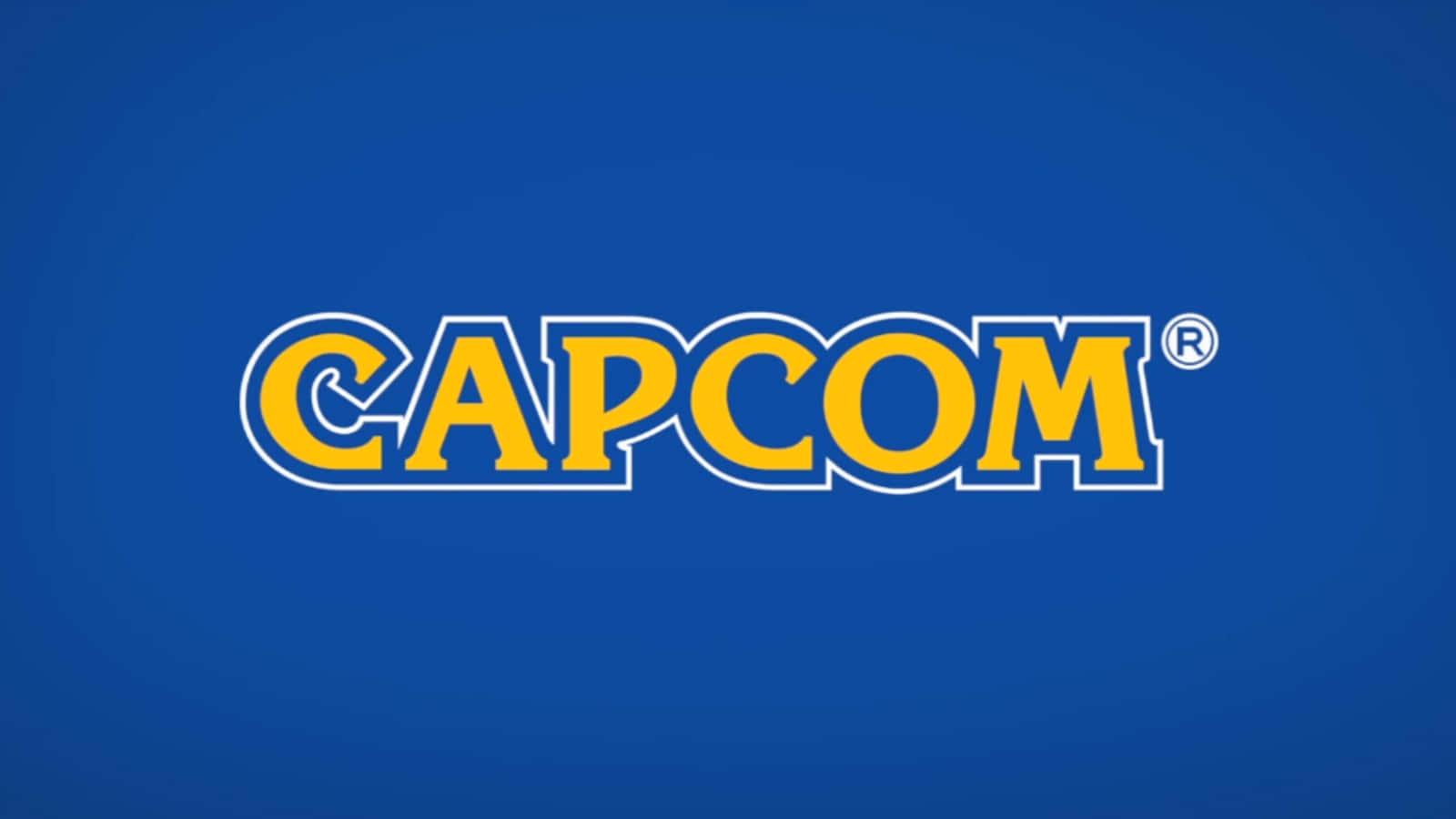 Capcom 桌布 壁紙 — 大膽的黃色 Capcom 標誌，帶白色輪廓，居中於純藍色漸變背景上。