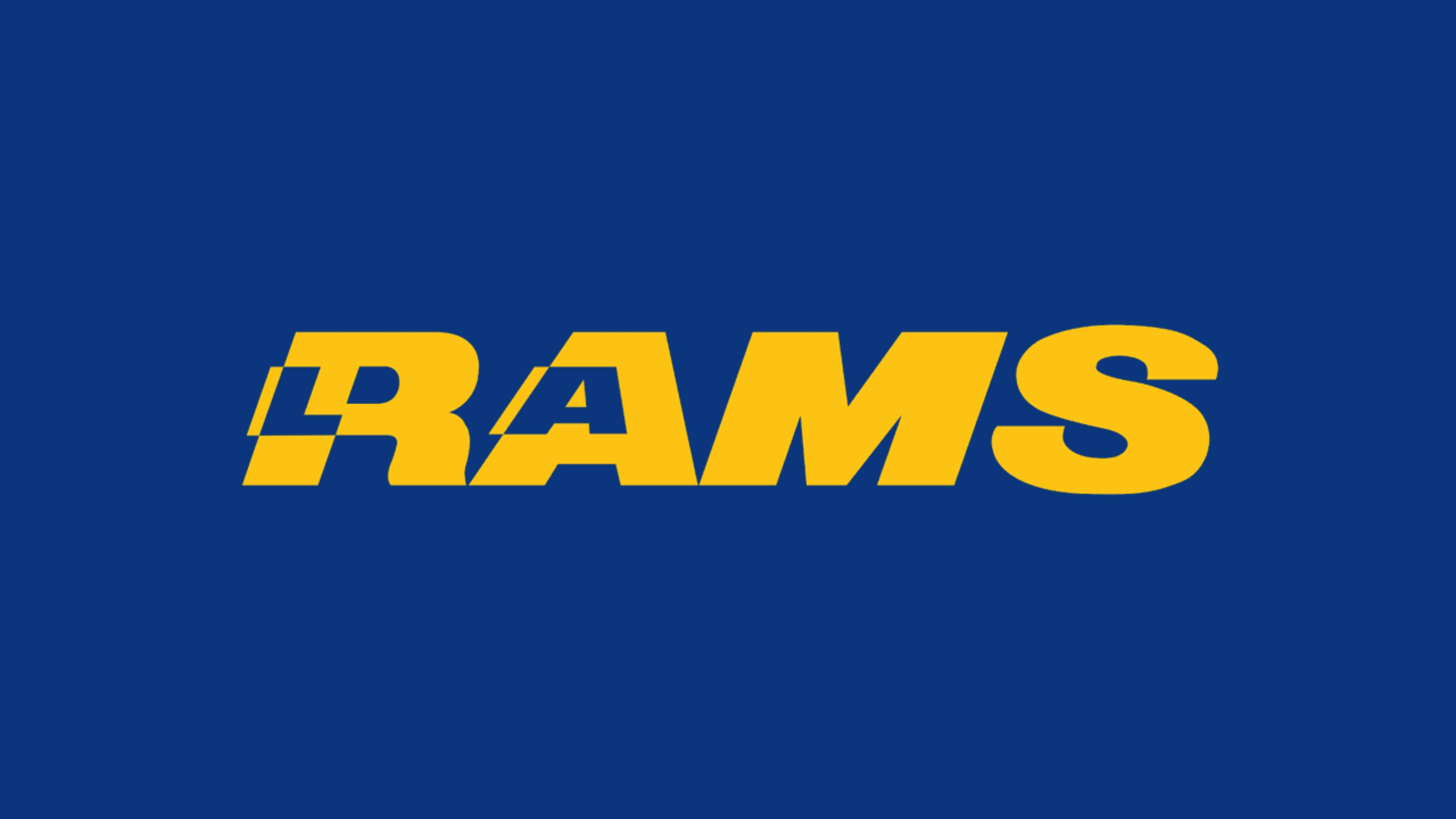 Rams 桌布 壁紙 — 大膽的黃色Rams標誌居中於純皇家藍色背景上，搭配簡潔的字體。